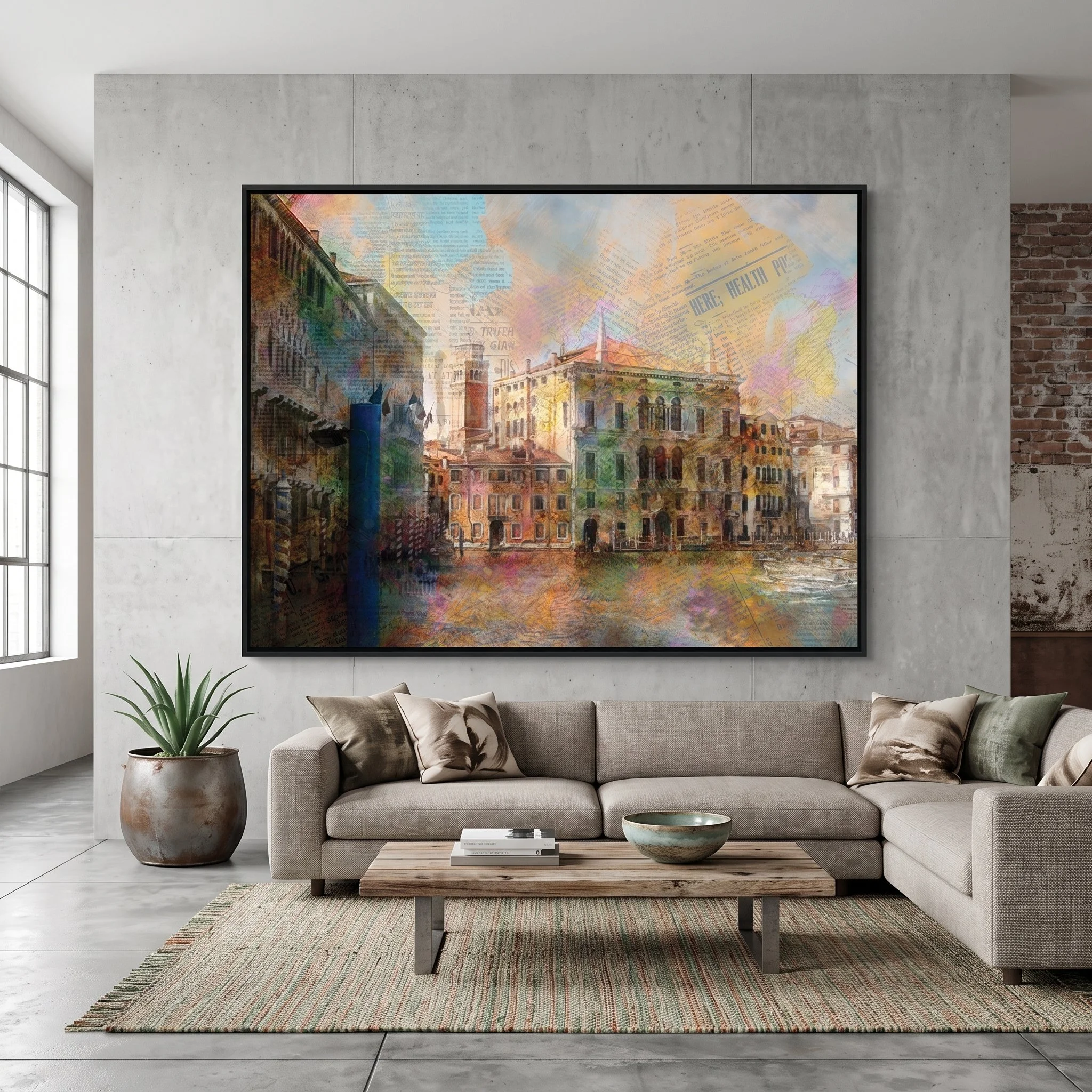 Large-format Venice fine art print hanging on a concrete wall in a bright industrial living room with a beige sectional sofa, rustic wooden coffee table, and large window