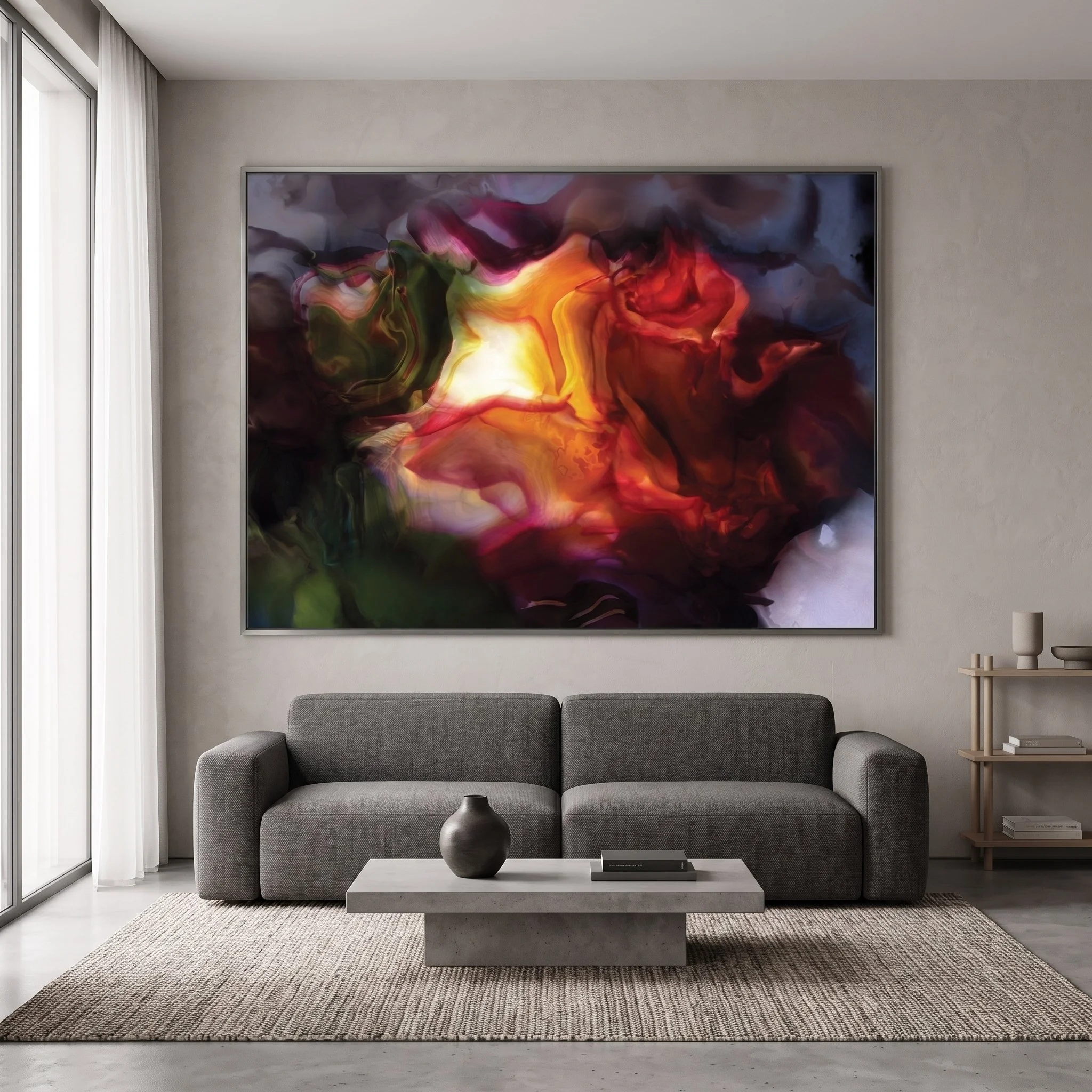 Large canvas art featuring a dark red and glowing orange abstract design hanging above a grey fabric sofa, with a low concrete coffee table and textured area rug.