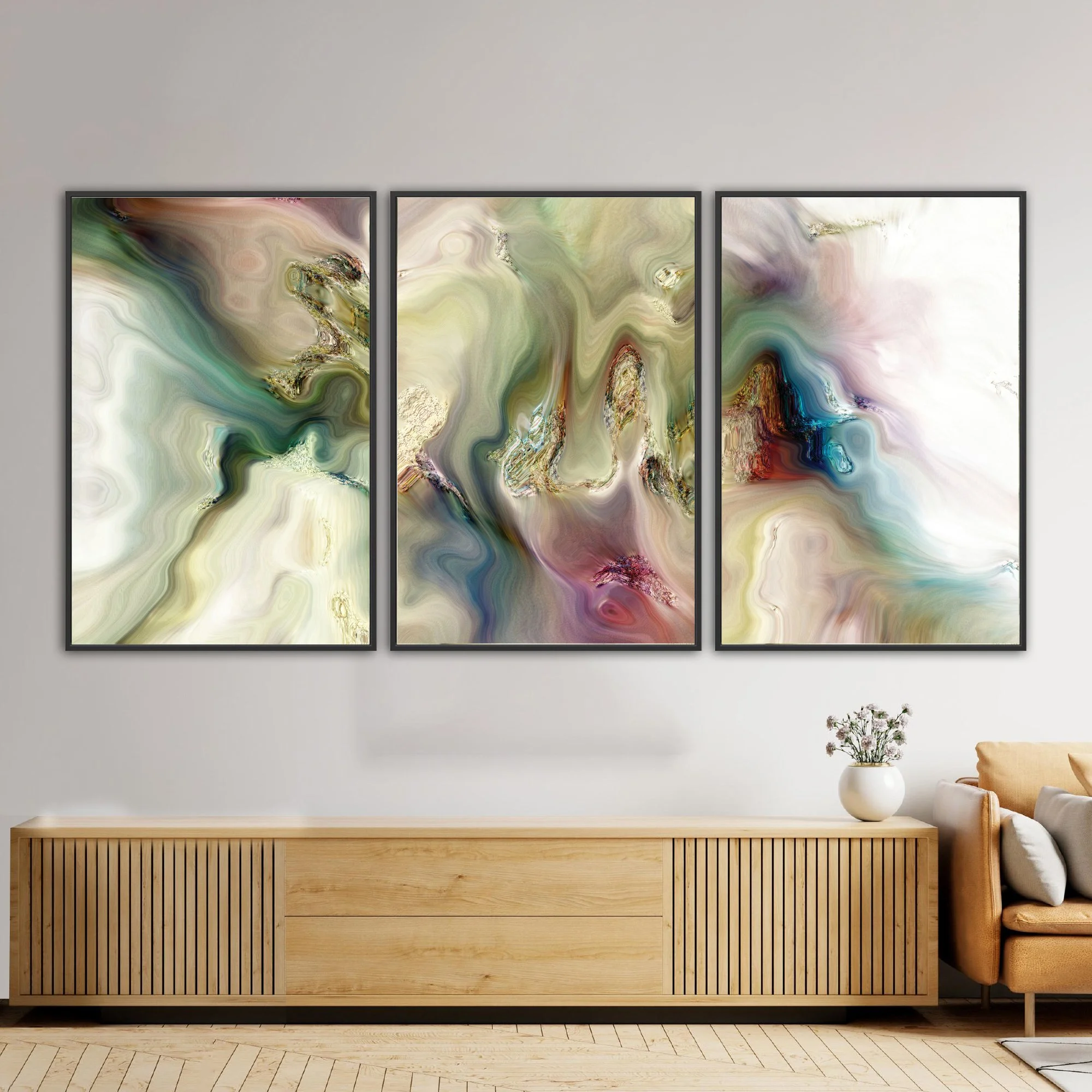 Abstract fine art triptych with marble textures and swirls in sage green, cream, and ocher tones with turquoise and violet highlights, framed and ready to hang. Over wooden console