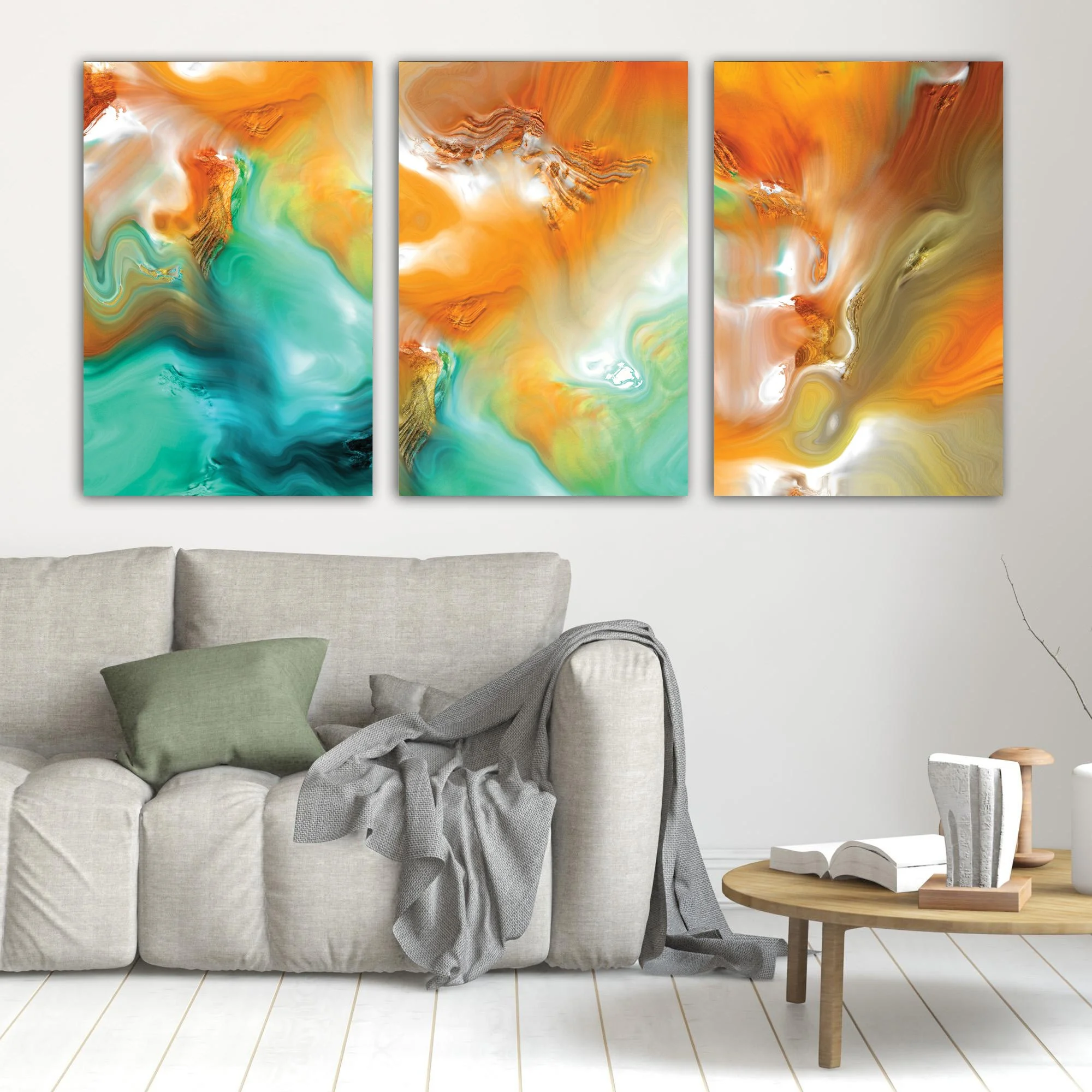 Abstract fine art triptych with flowing liquid marble textures in orange, ocher, and teal green tones, over a bright background, framed and ready to hang. In living room