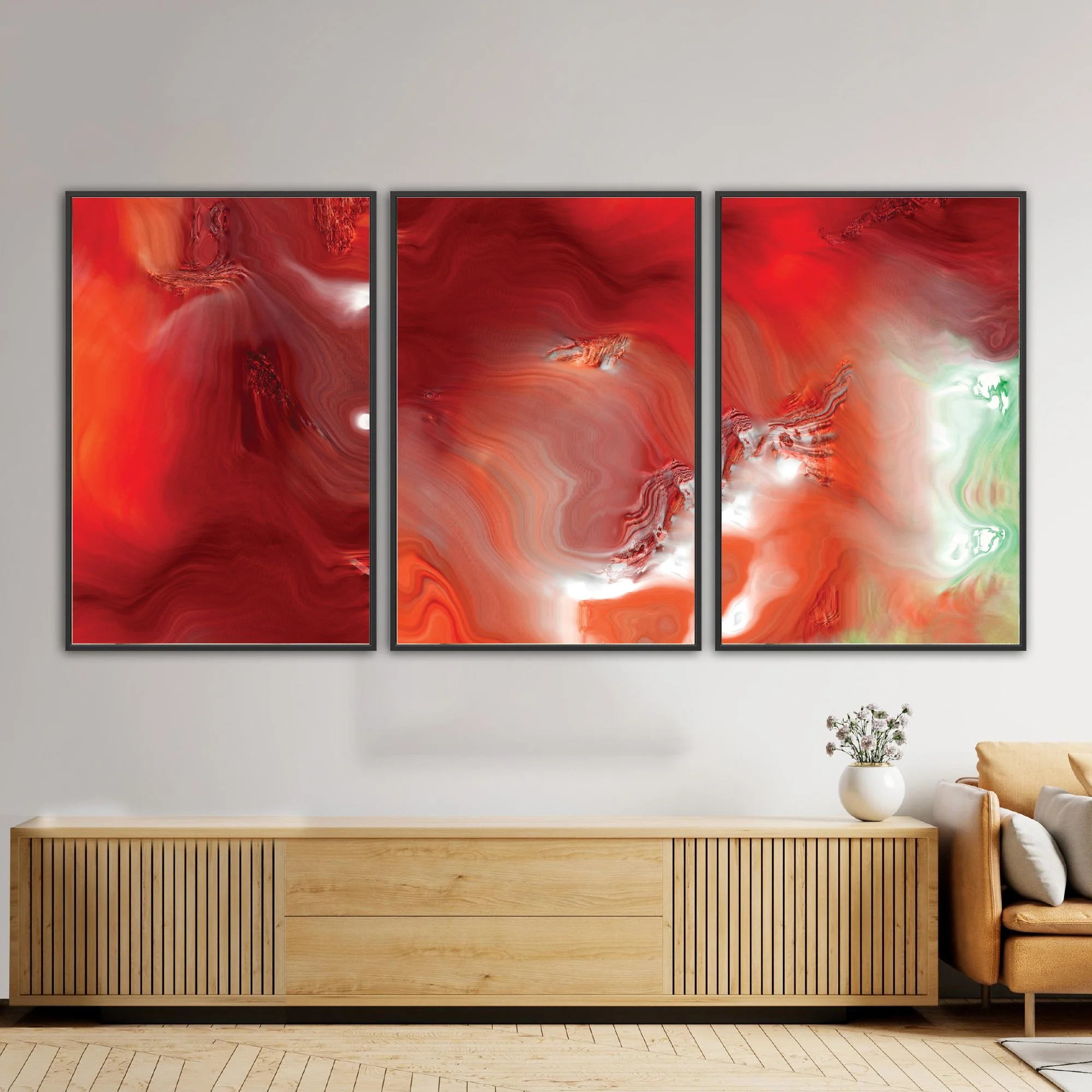 Abstract fine art triptych with dense, flowing liquid marble textures in vibrant crimson red, burgundy, and coral orange, white highlights and light green, framed and ready to hang. Over console