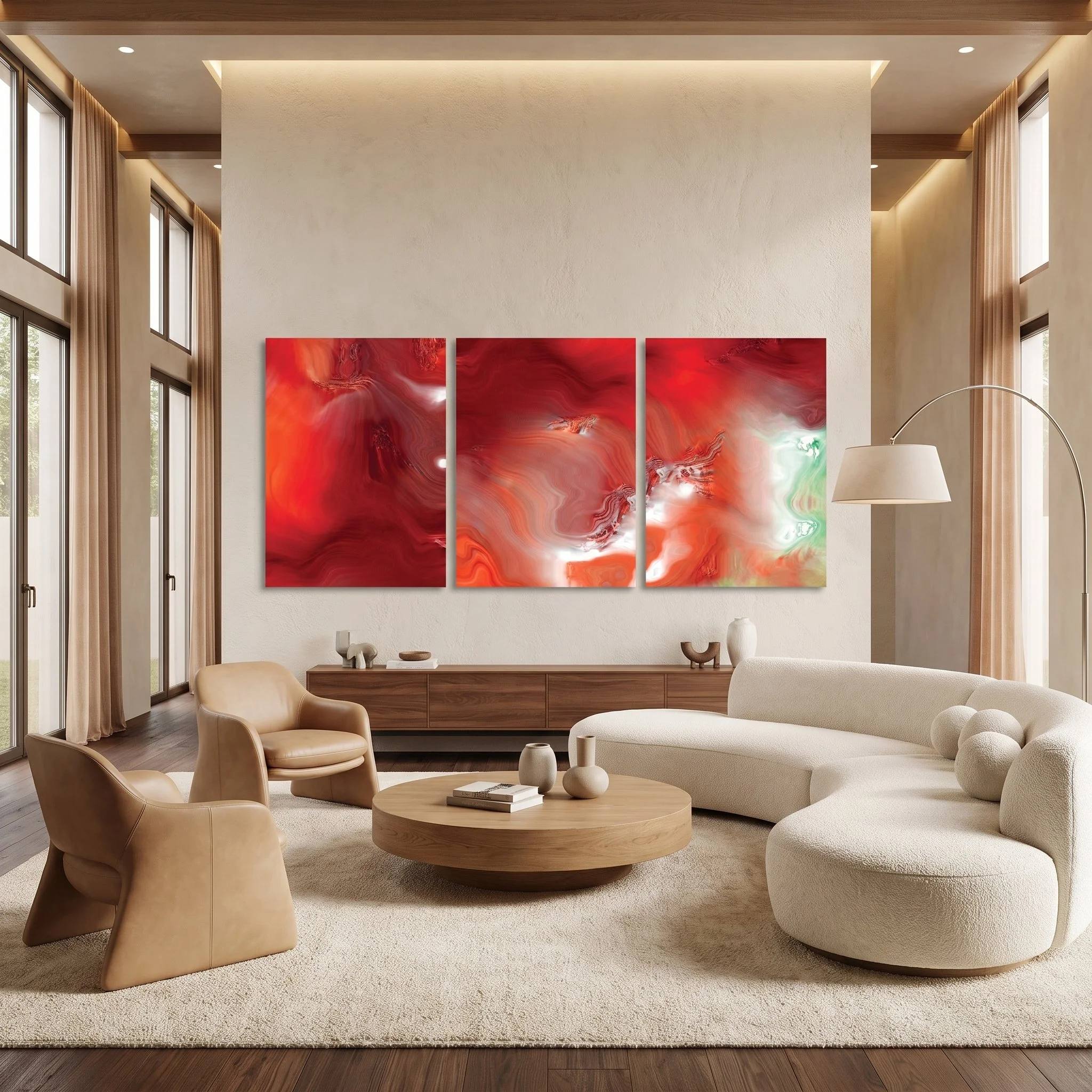 A red abstract art triptych hanging above a wooden credenza in a luxury living room featuring a curved beige sofa and tall windows.