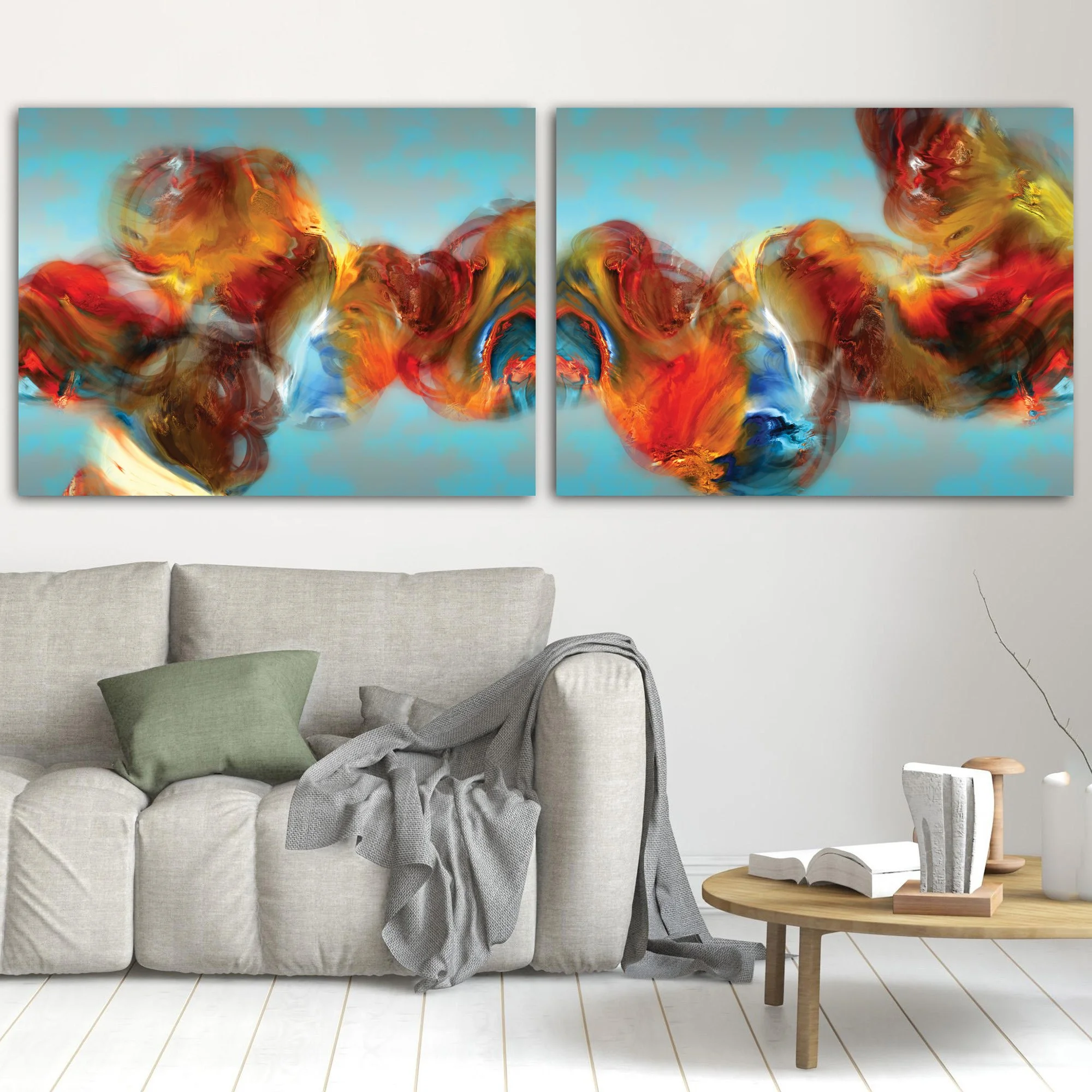 Abstract diptych with textured, cloud-like fluid shapes in red, orange, and golden ocher against a cerulean sky blue background, framed and ready to hang. In living room