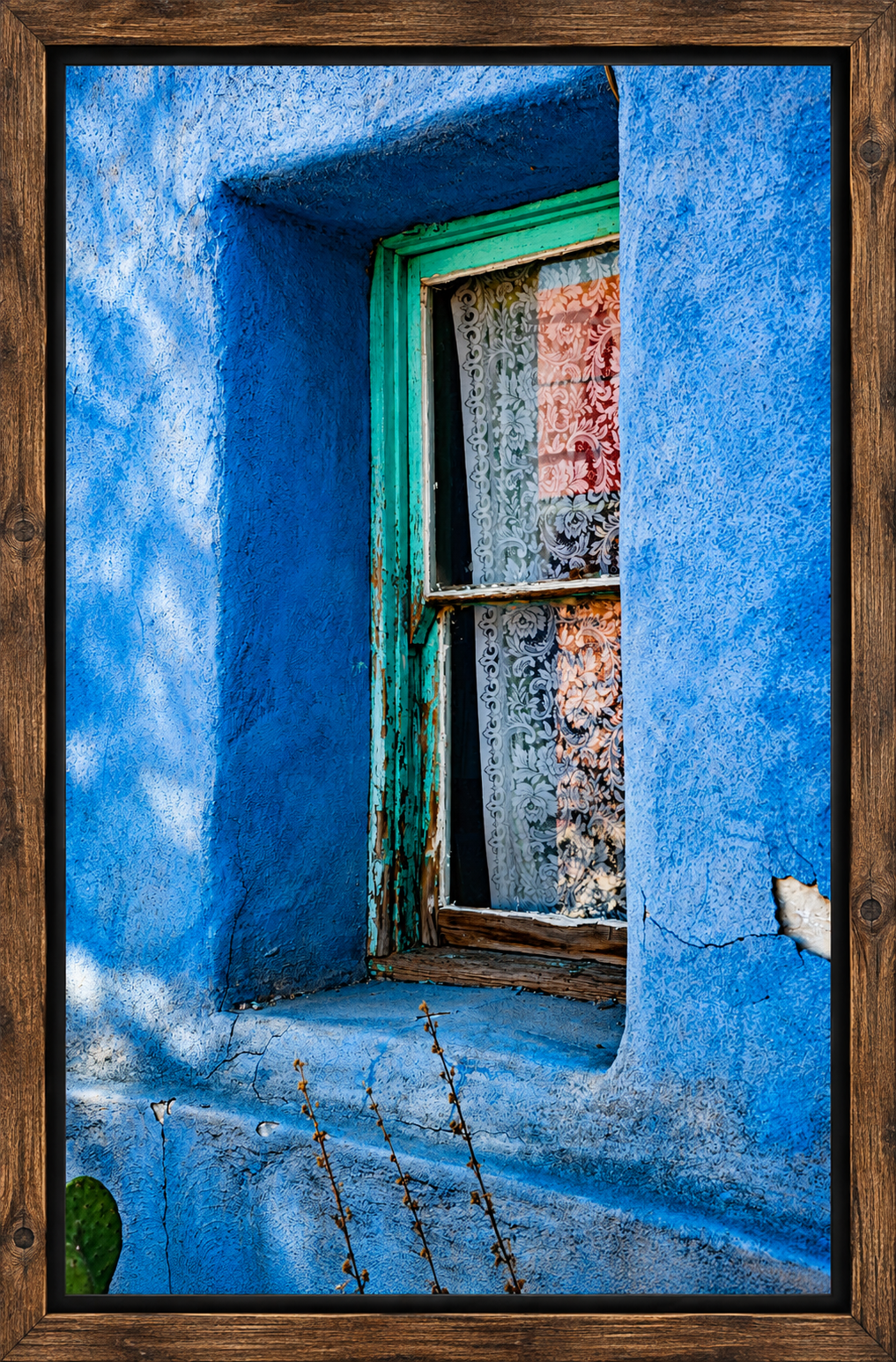 Framed Turquoise Window in Blue Stucco.png