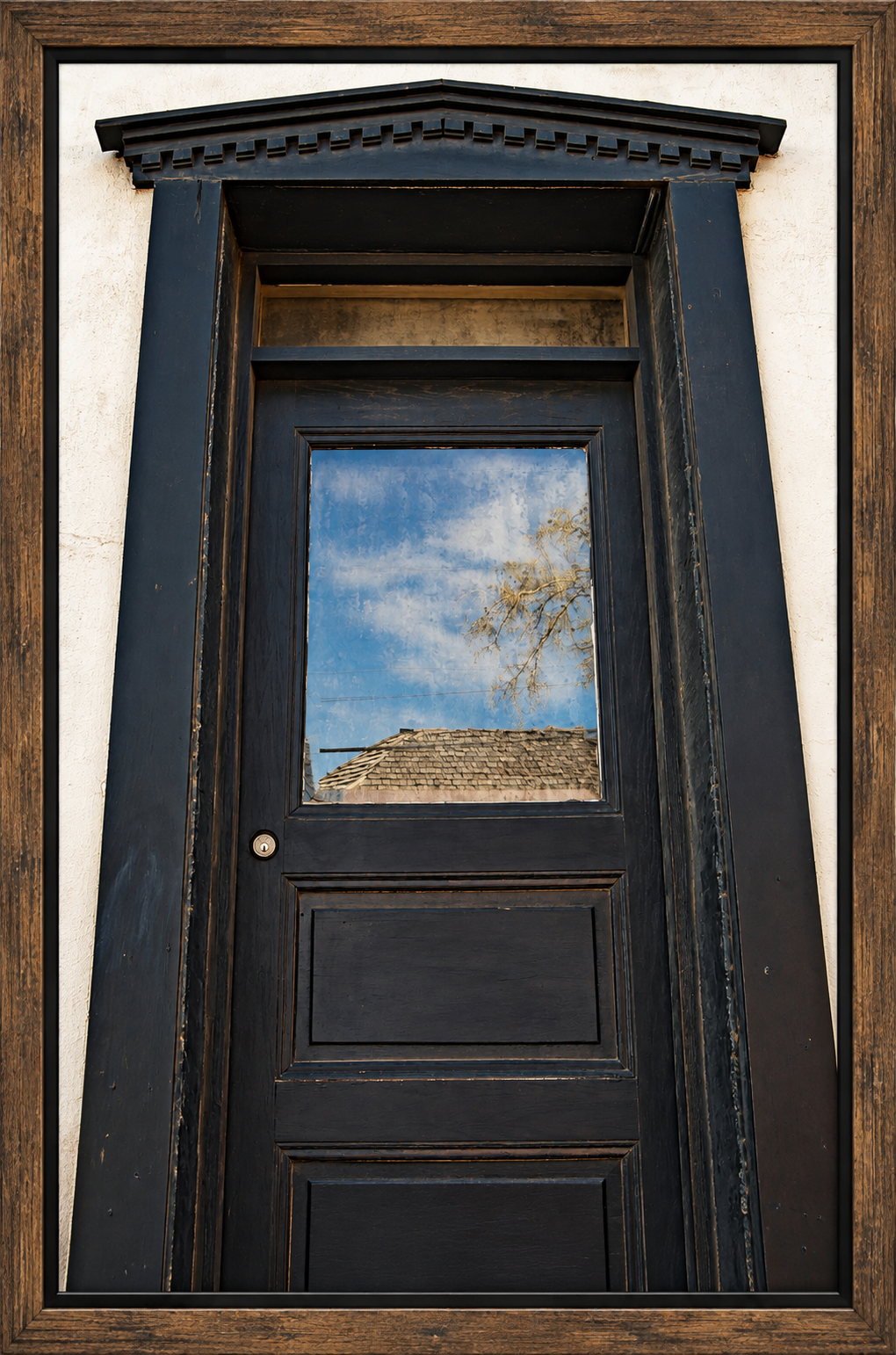 Framed Weathered Classical Door Reflecting Sky.png