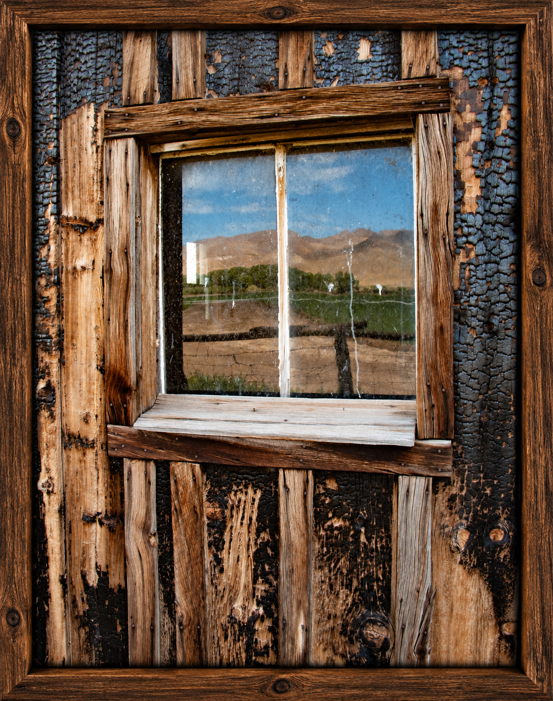 Weathered Cabin Window in Wood Frame.png
