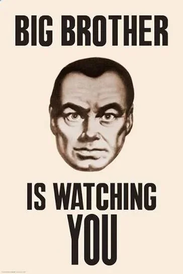 A poster with a black-and-white illustration of a man's face and the text "Big Brother is Watching You" in bold black letters.