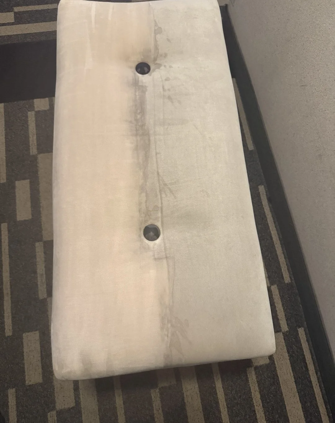 Partially cleaned cushioned bench