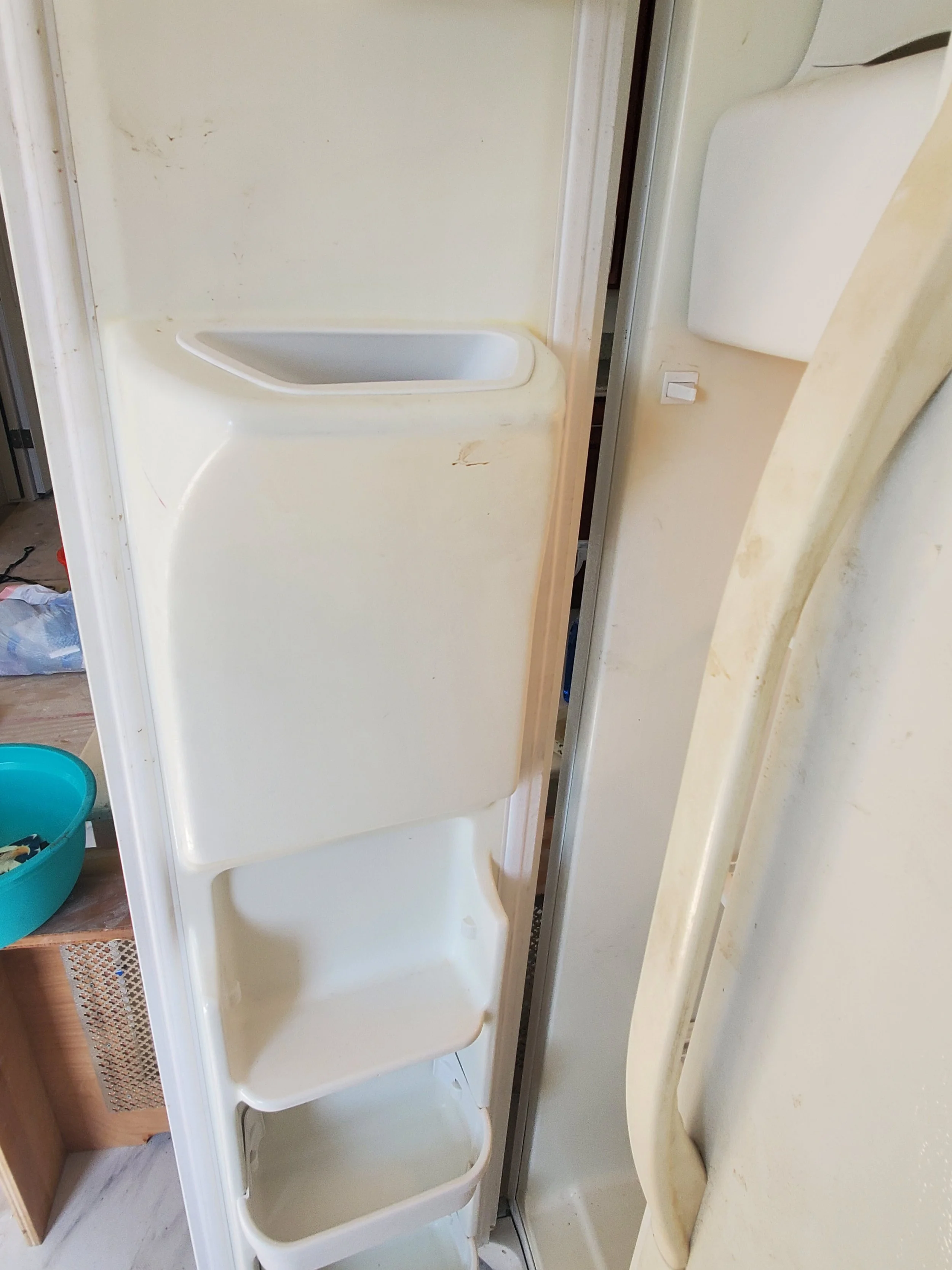 SOILED REFRIGERATOR DOOR AND INTERIOR - BEFORE CLEAN-UP