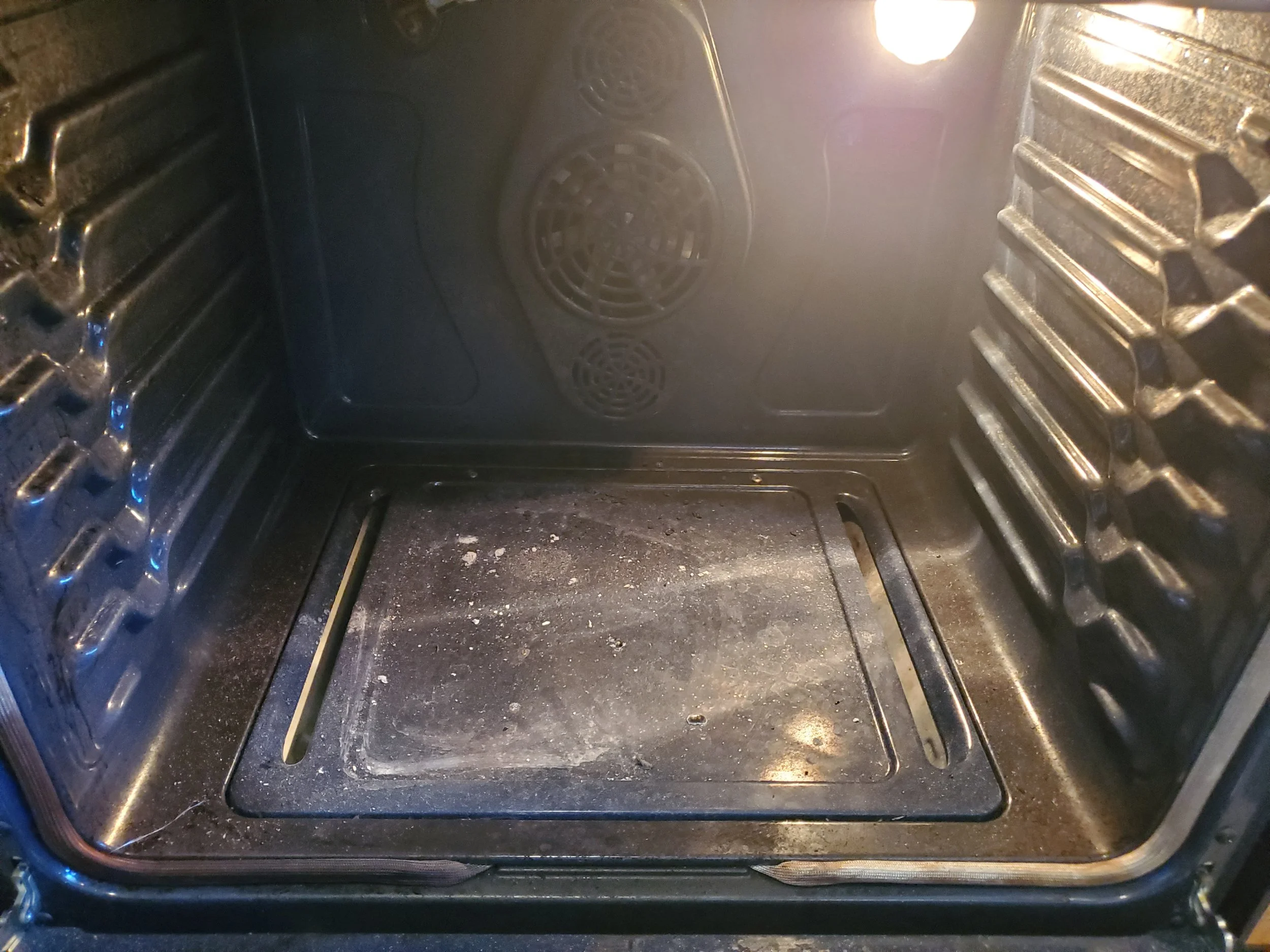 BURNT FOOD INSIDE OF OVEN - BEFORE CLEANING