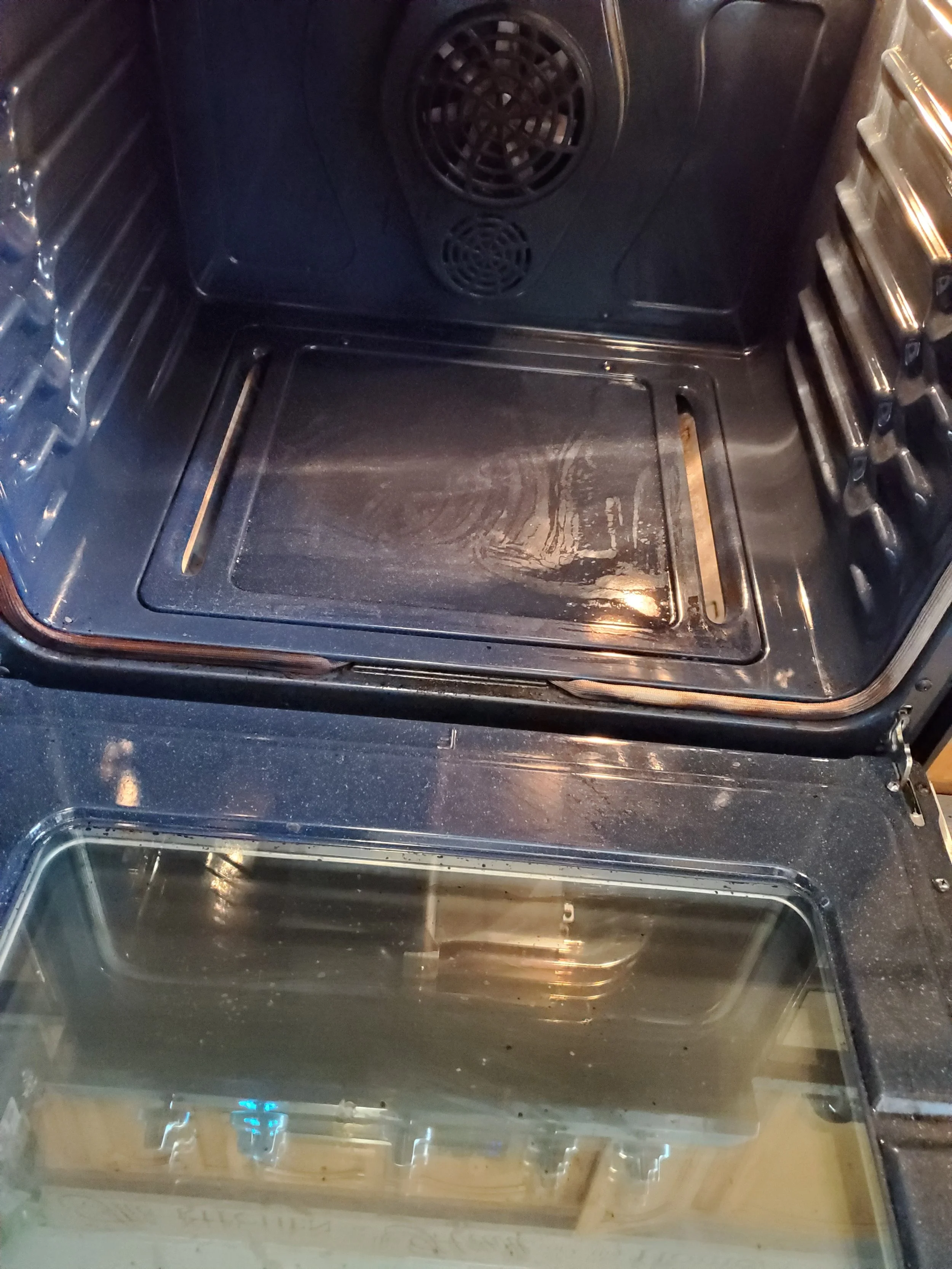BURNT FOOD REMOVED FROM OVEN INTERIOR - AFTER CLEANING
