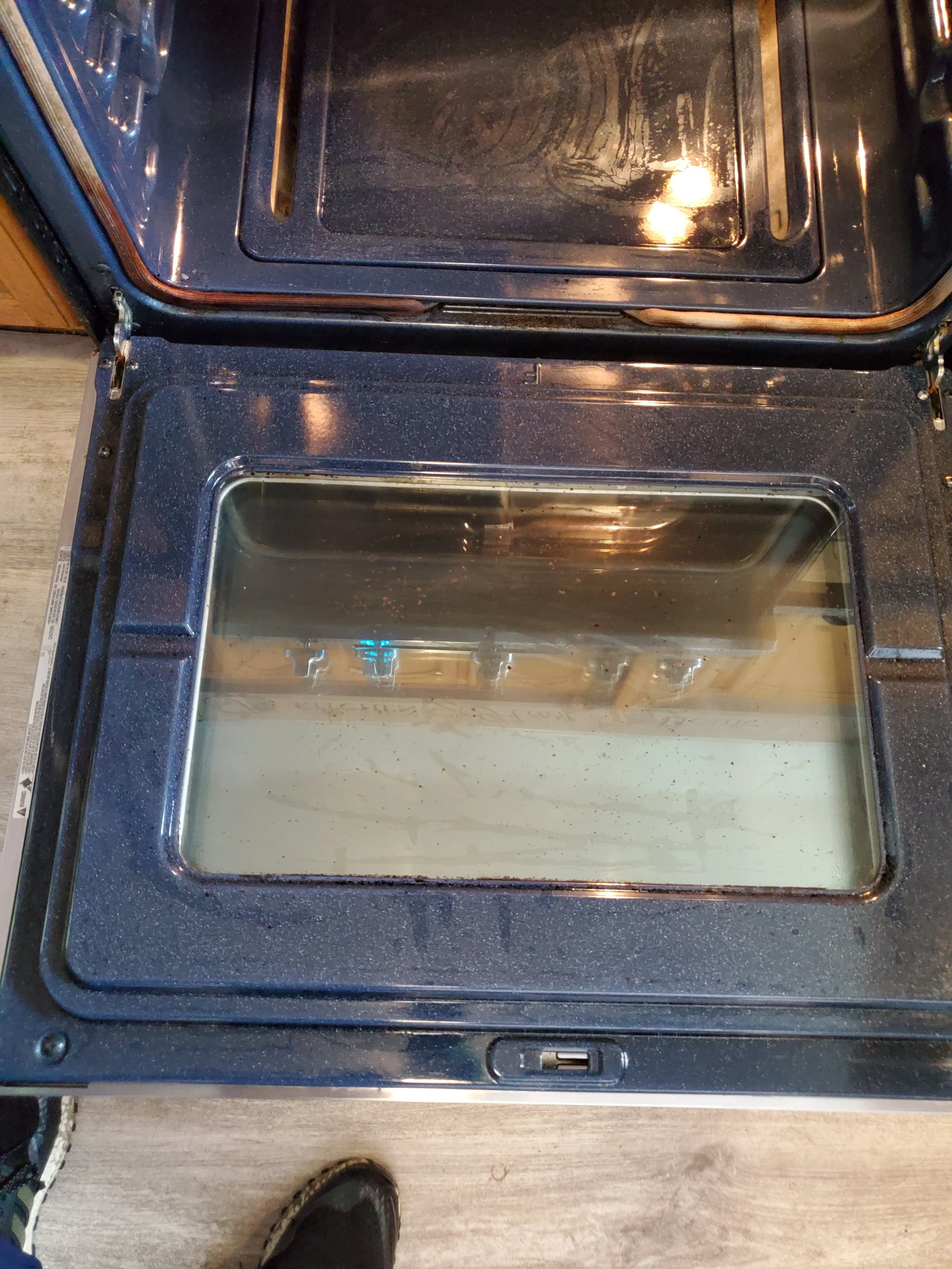 BURNT FOOD REMOVED FROM OVEN DOOR - AFTER CLEANING