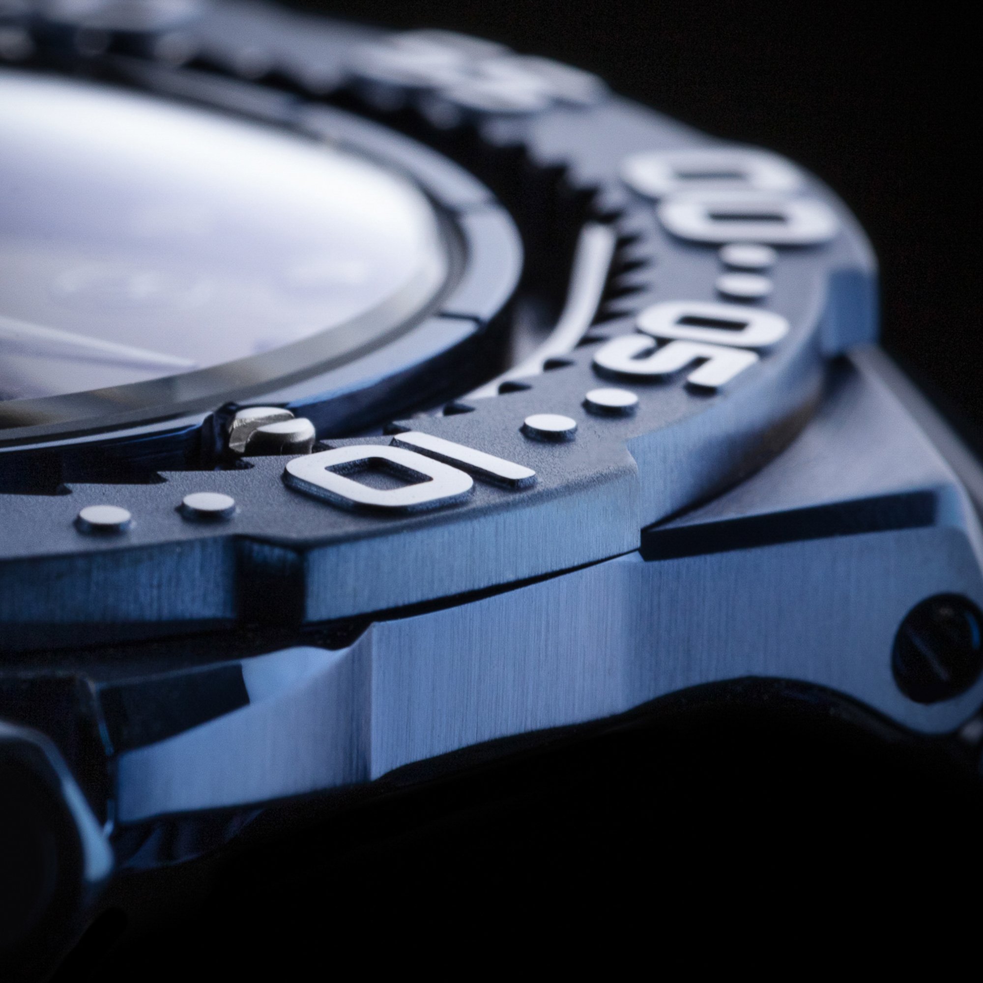 Close-up of a Rolex watch with a metal band, showing the watch face and part of the bezel.