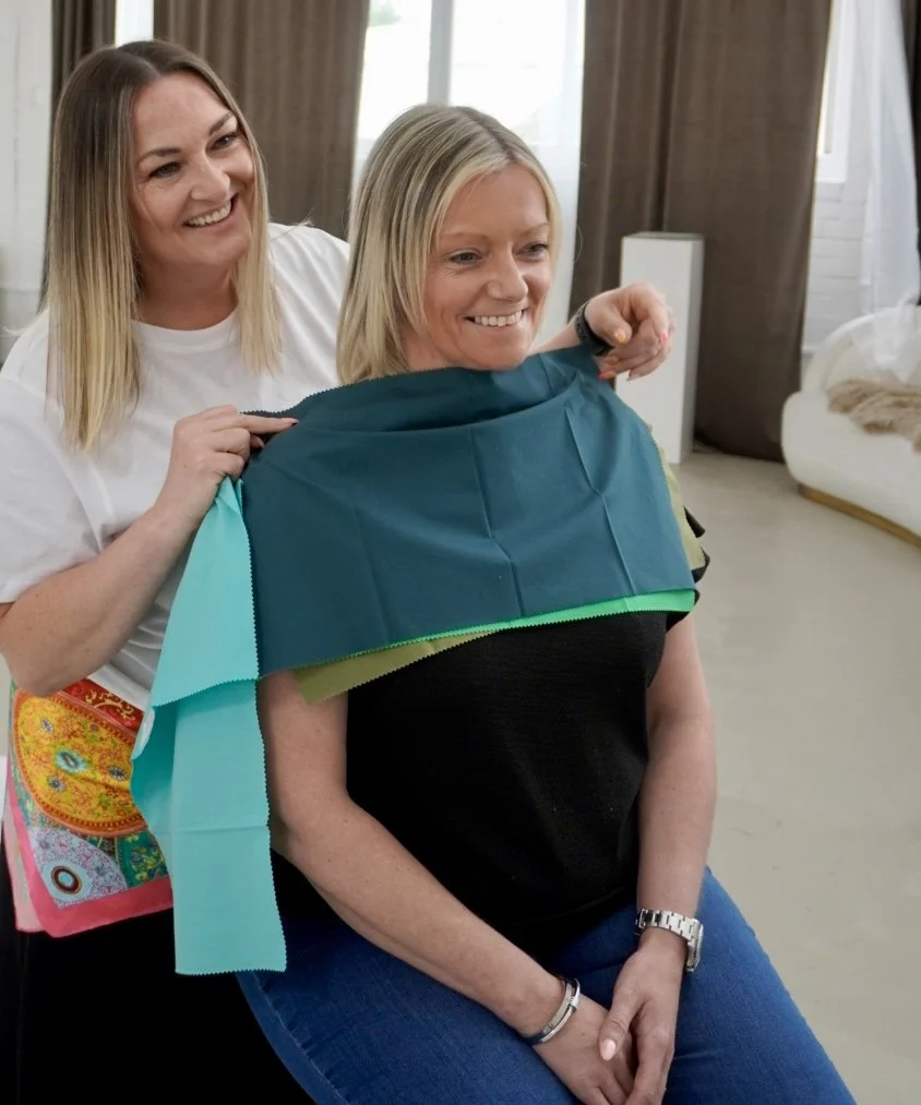 Personal colour analysis consultation using green colour drapes to identify the most flattering shades for a clients seasonal colour palette.