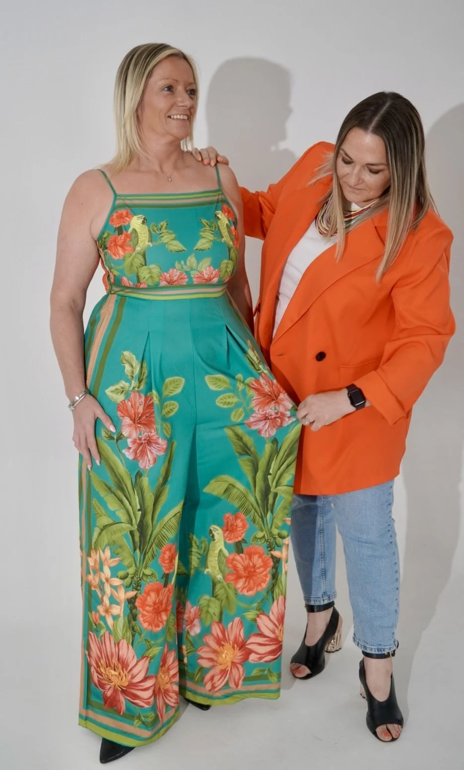 Personal styling consultation helping a woman choose clothing styles and colours that compliment her natural features and body shape.