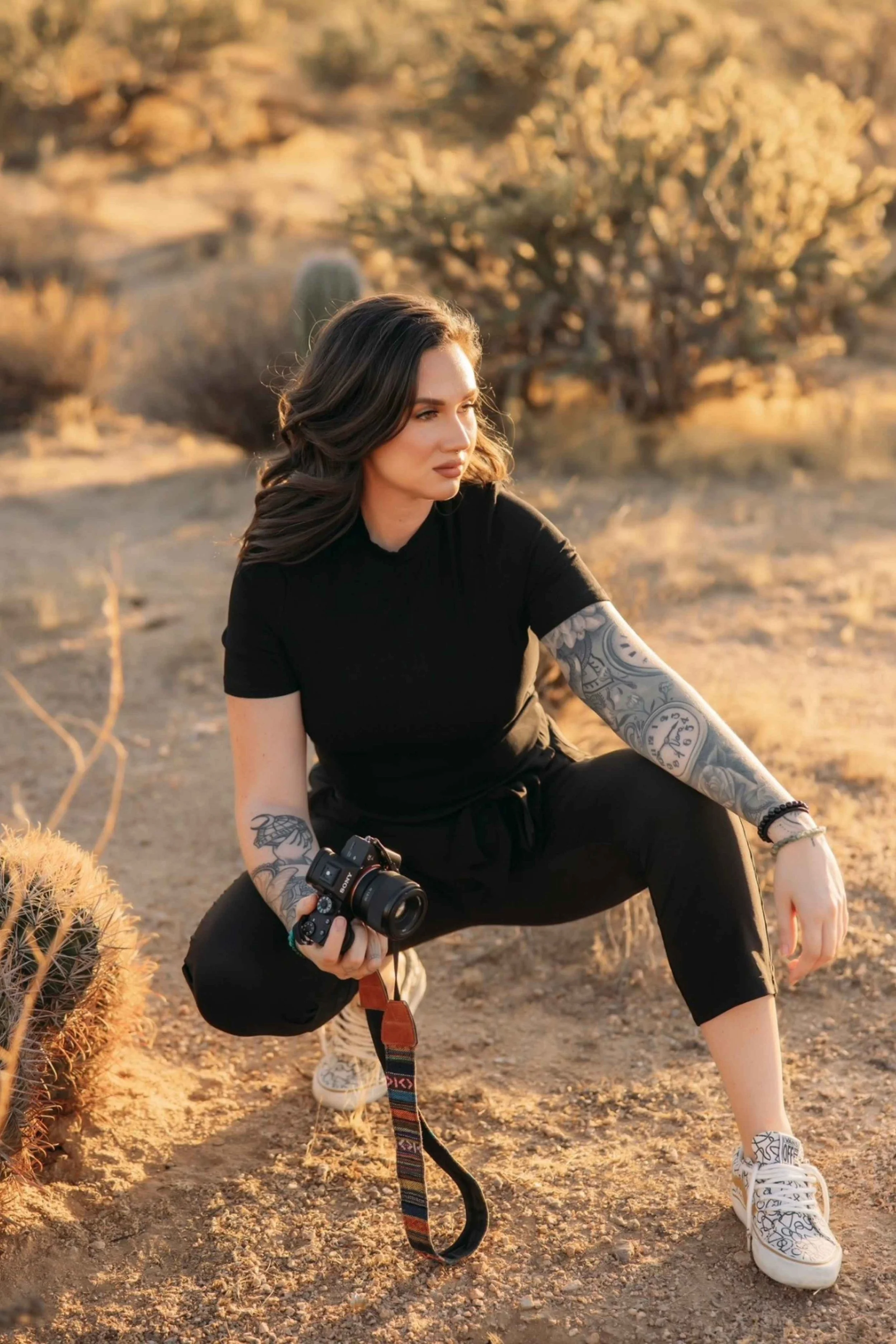 kait headshot mesa arizona boudoir photographer crouching in desert