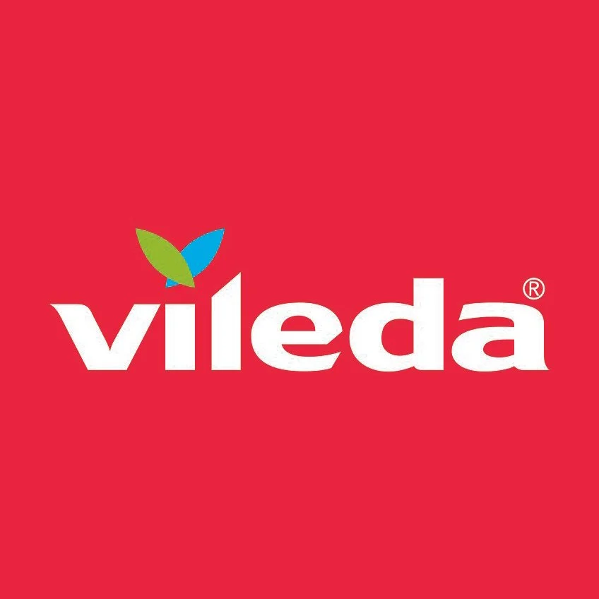 Vileda logo featuring white text and a small green and blue leaf design on a red background.
