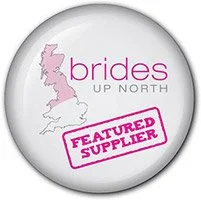 Button with a graphic of the UK and the words 'brides UP NORTH' and a pink 'FEATURED SUPPLIER' stamp.