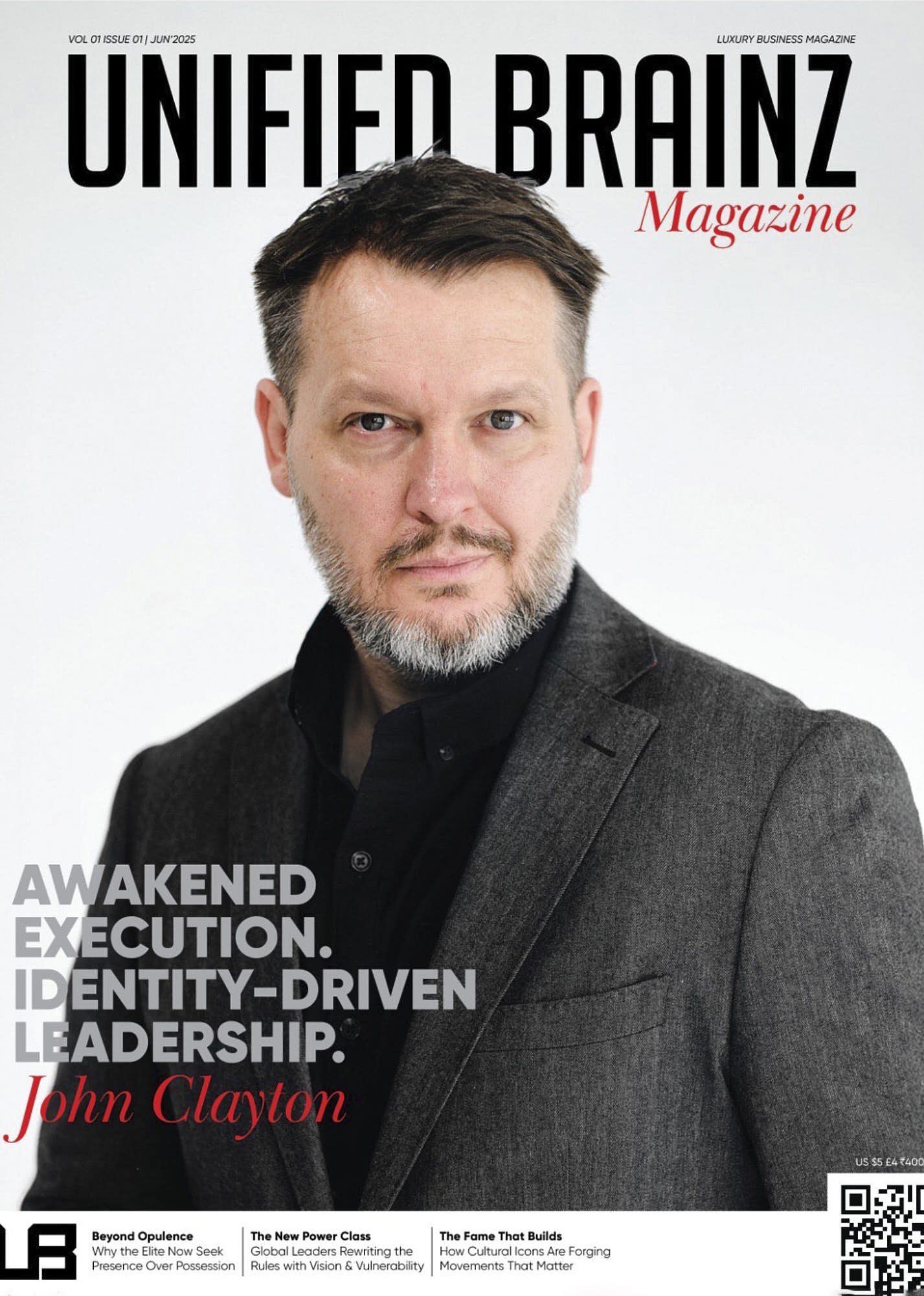 Cover of Unfied Brainz Magazine featuring a man with short dark hair and a beard wearing a dark blazer and black shirt against a white background. The magazine includes headlines about leadership, identity, and cultural icons.