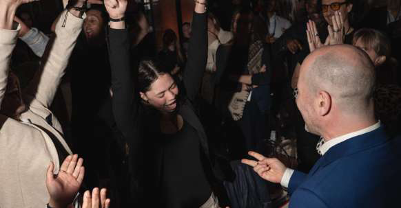 People dancing and enjoying a celebration or party.