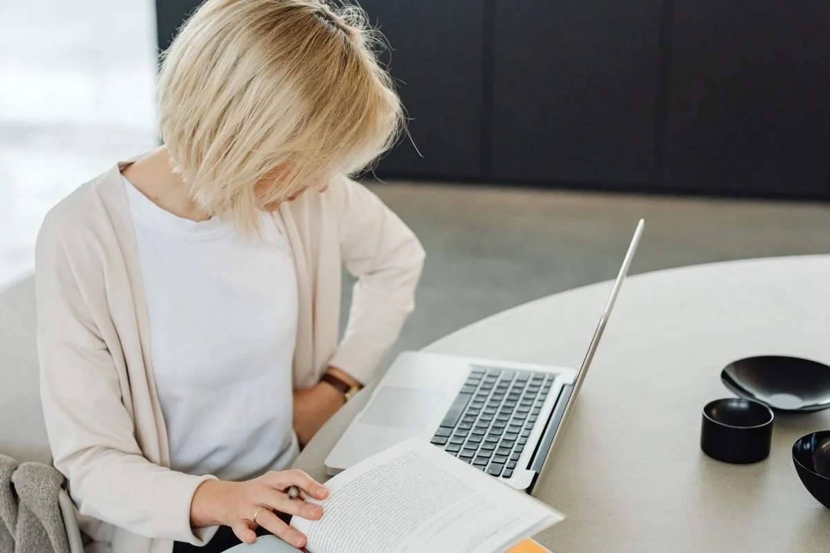 woman at her laptop reading and researching to understand her fertility results