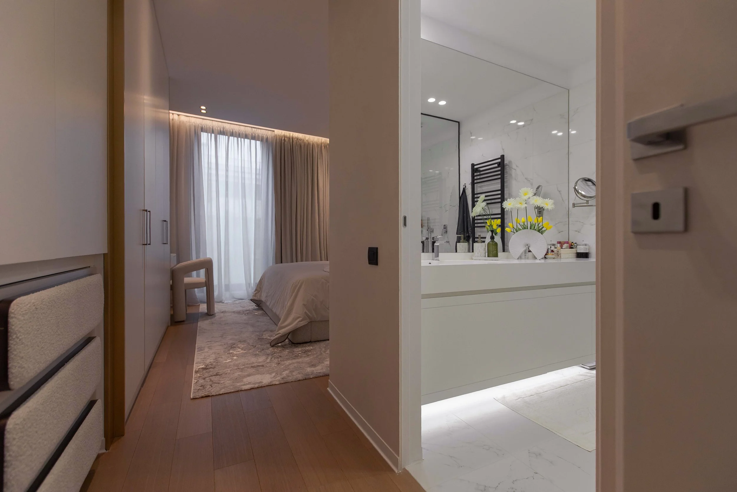 Toward the soft white bedroom