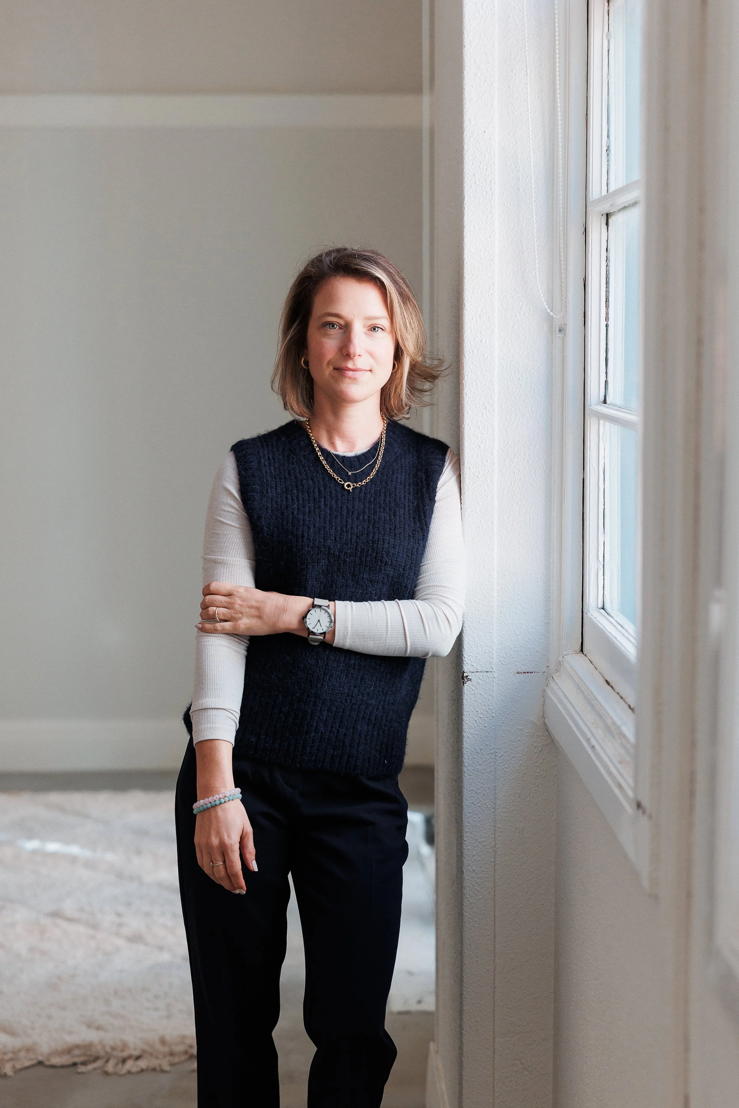 Natalie Claire King, couples therapist in Wodonga, standing by a window.