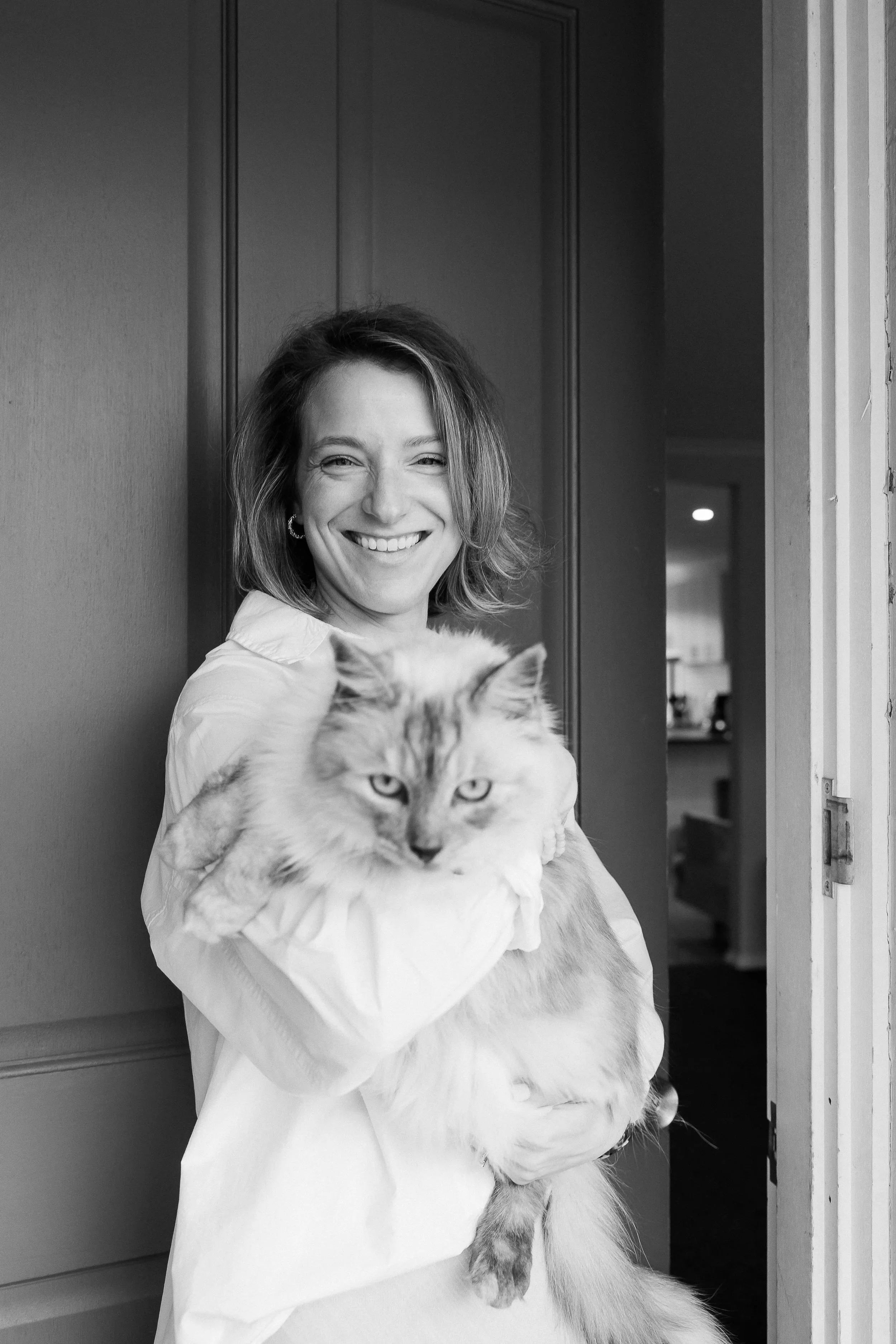 Natalie Claire King, EFT couples therapist in Wodonga, at home with her cat.