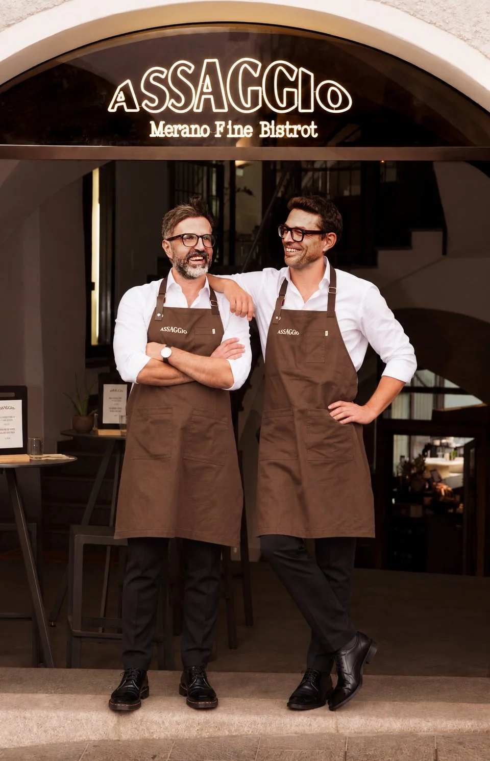 Korab & Michael, dreaming in brown aprons outside Assaggio Merano Fine Bistrot