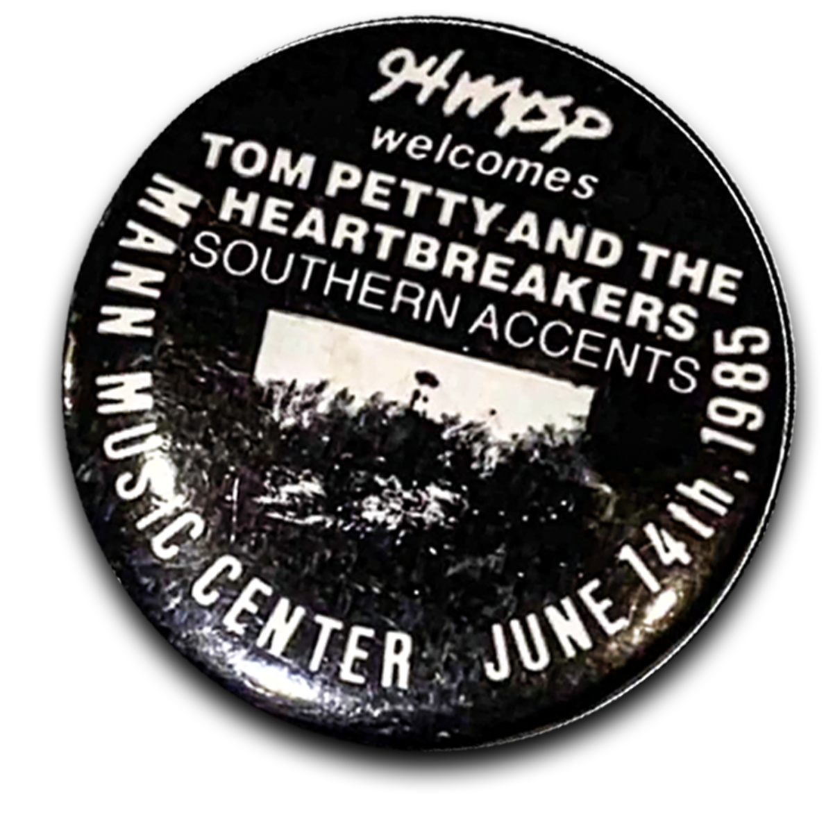 A circular sign welcoming Tom Petty and the Heartbreakers with Southern accents, located at 2040 Central June 14, 1985.