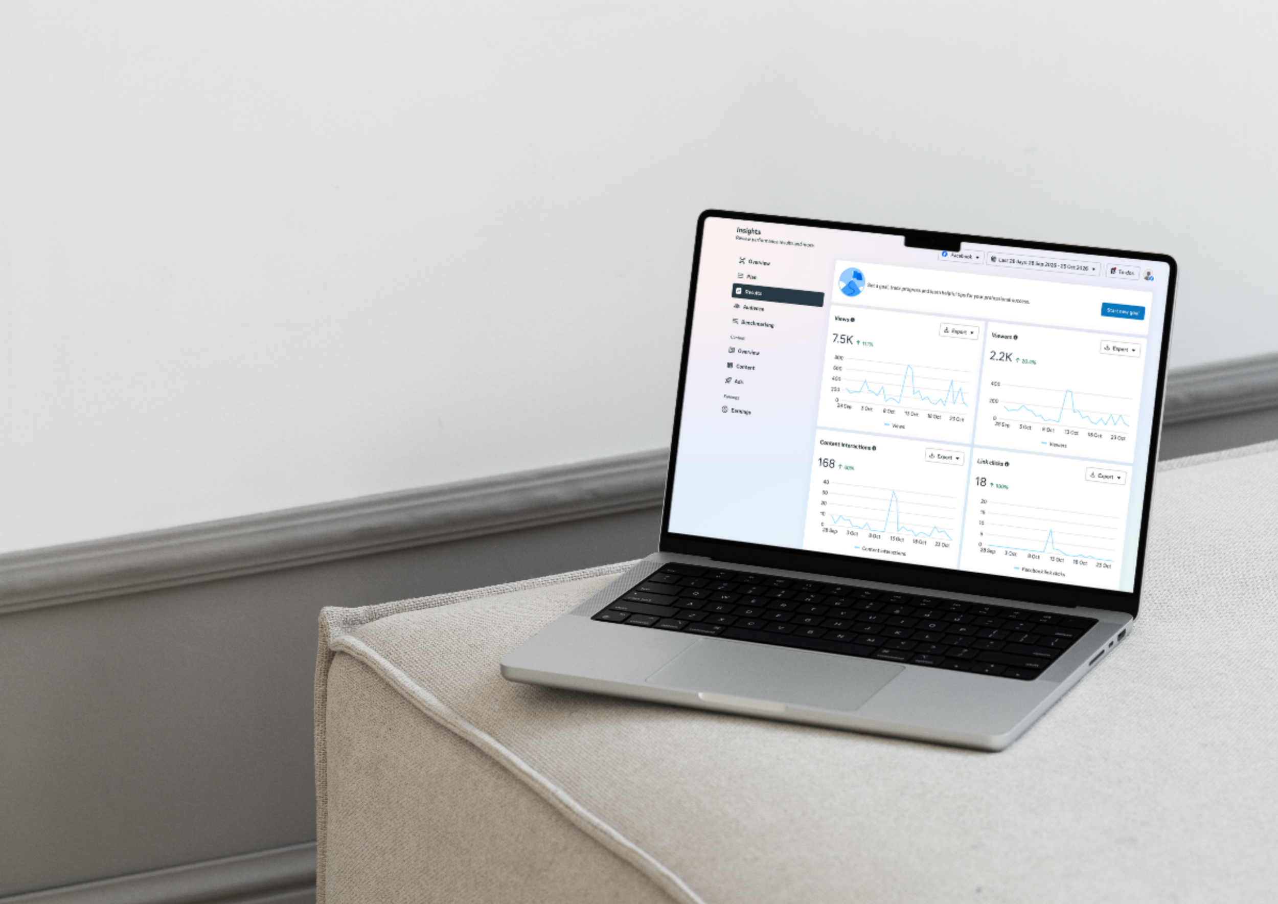 A laptop showing a screenshot of the Meta Business Suite Insights page