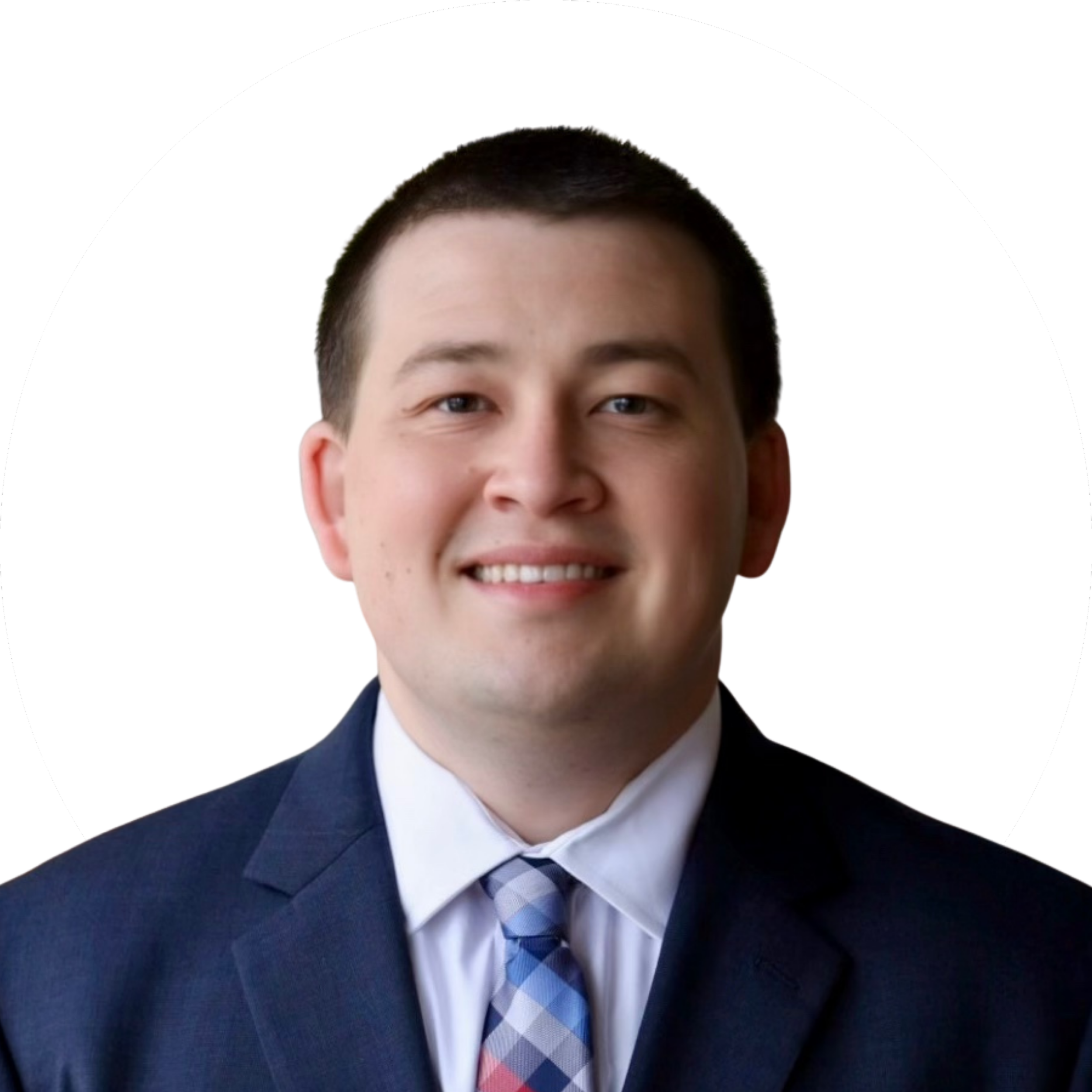 Professional portrait of a smiling young man in a dark suit, white shirt, and patterned tie, with a white background and black circular border.