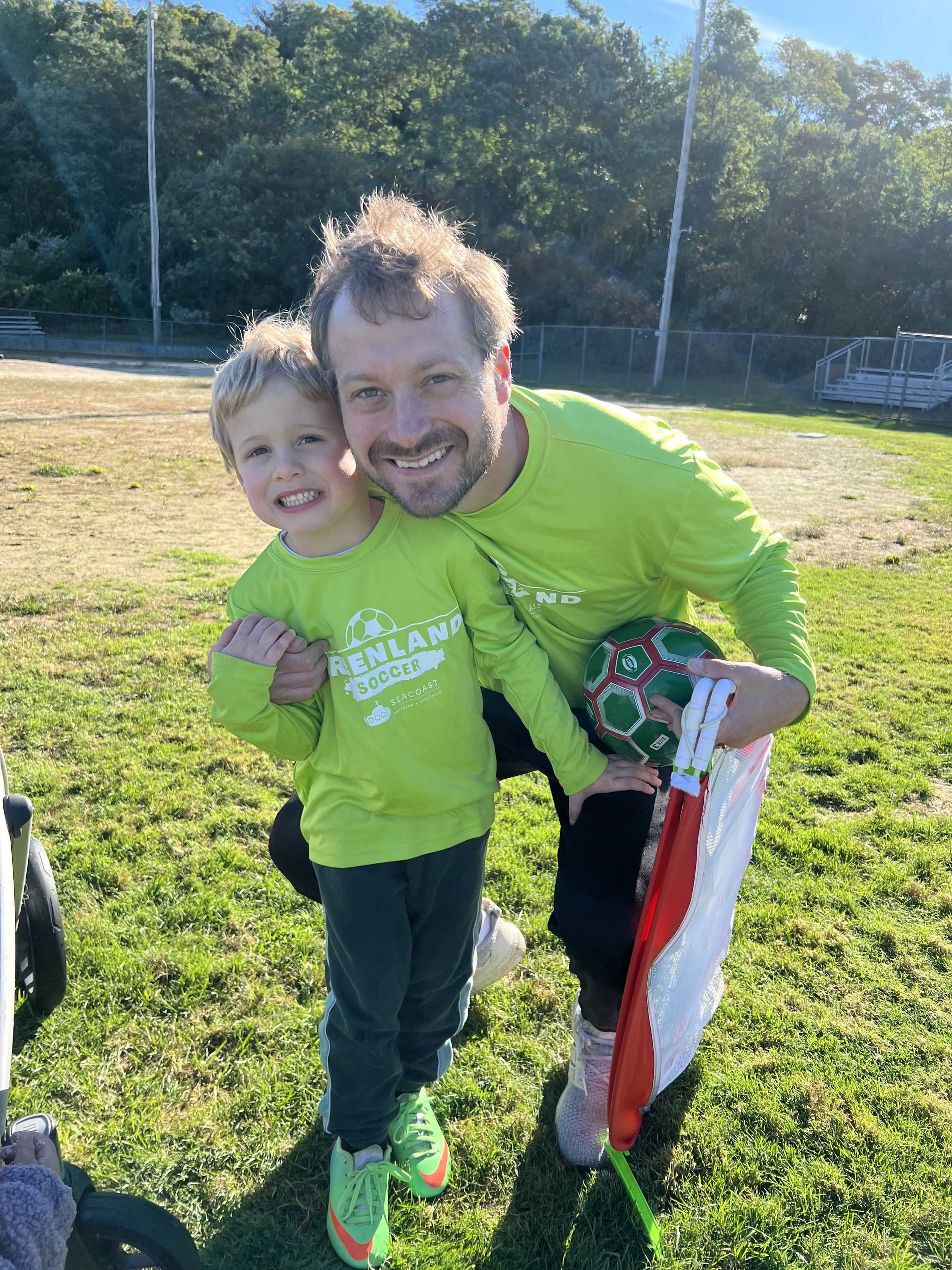 Soccer coach with young player