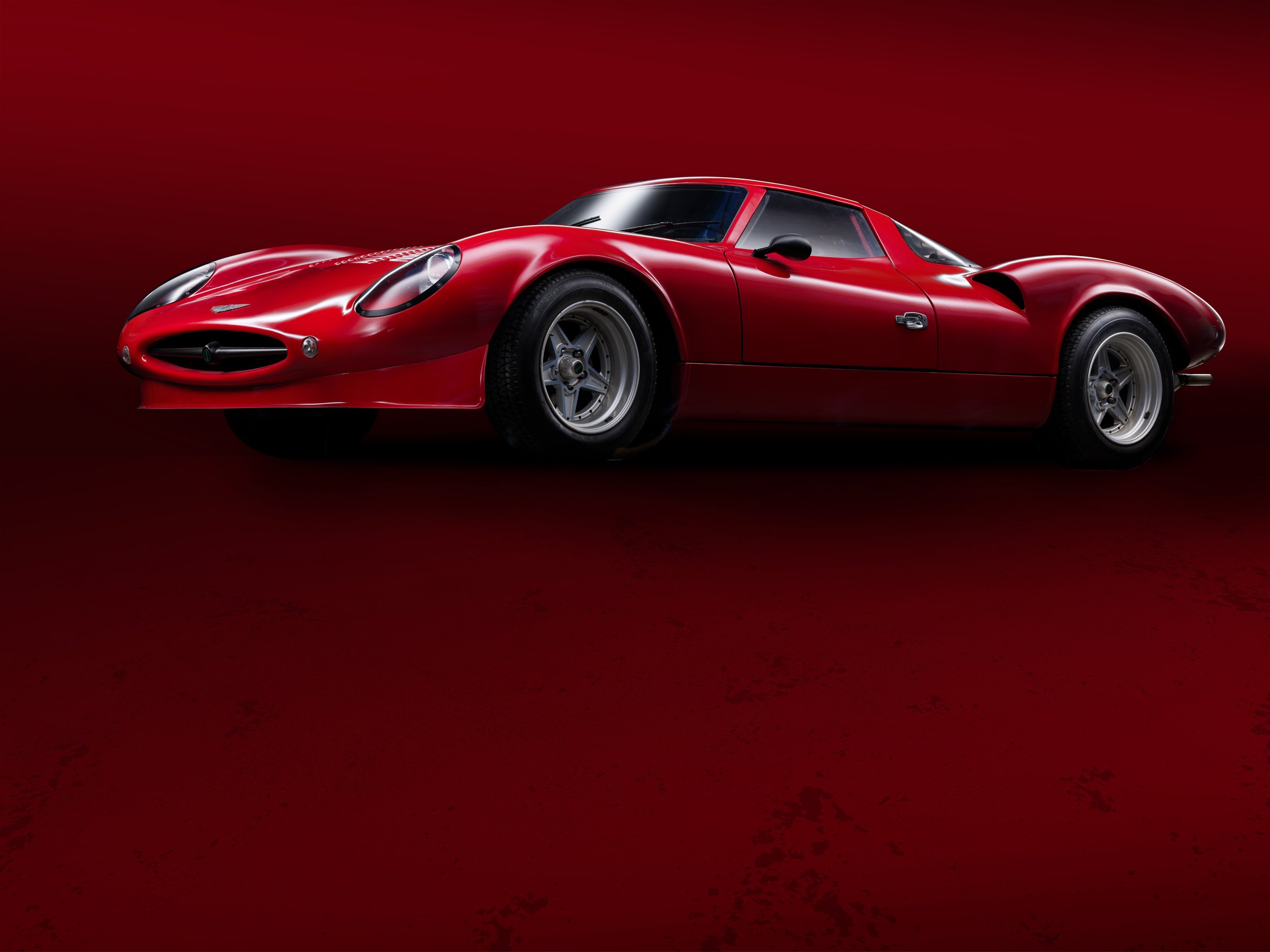 „Hochwertige, individuelle Studiofotografie für besondere Fahrzeuge: Mercedes 300 SL Flügeltürer, Ferrari 250 GTO, Bugatti, Bentley u.v.m. Jetzt bespoke Automobilfotos anfragen!" Invicta