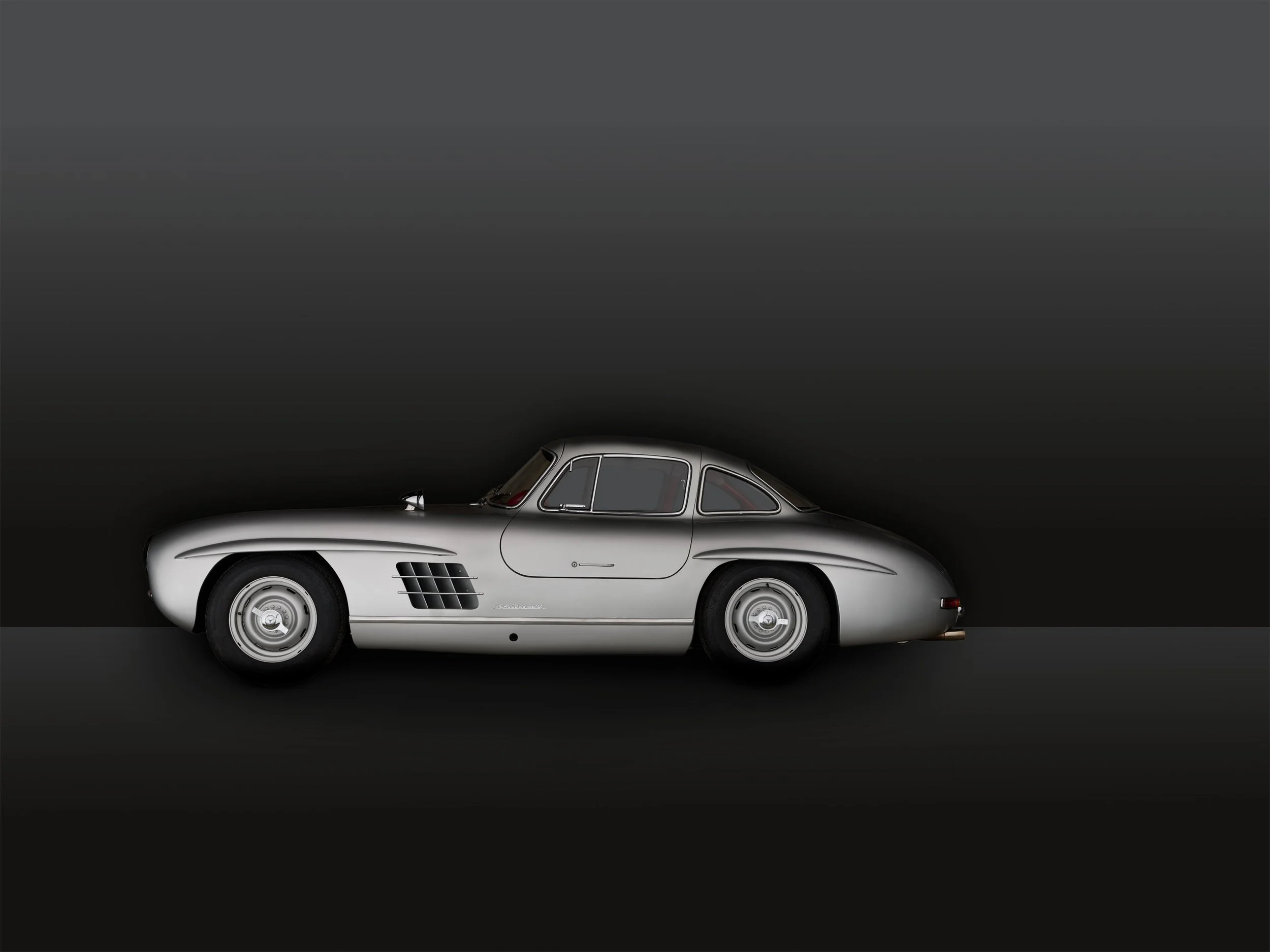 „Hochwertige, individuelle Studiofotografie für besondere Fahrzeuge: Mercedes 300 SL Flügeltürer, Ferrari 250 GTO, Bugatti, Bentley u.v.m. Jetzt bespoke Automobilfotos anfragen!"