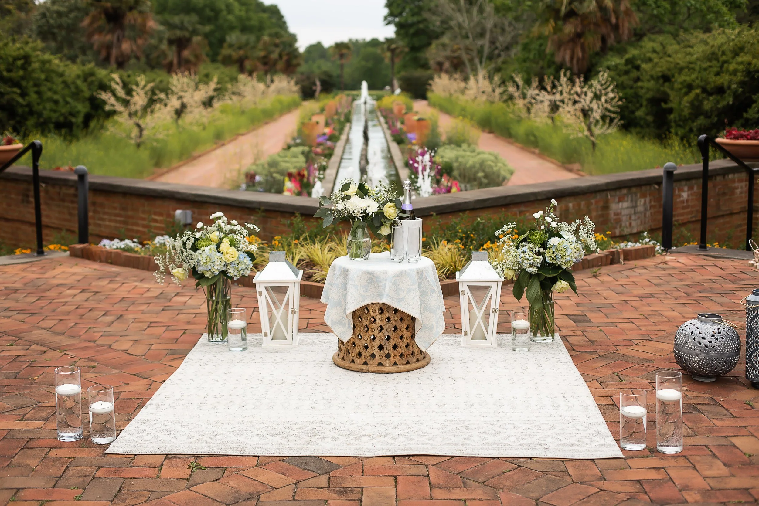 professional picnic set up for surprise proposal at daniel stowe botanical garden in the spring