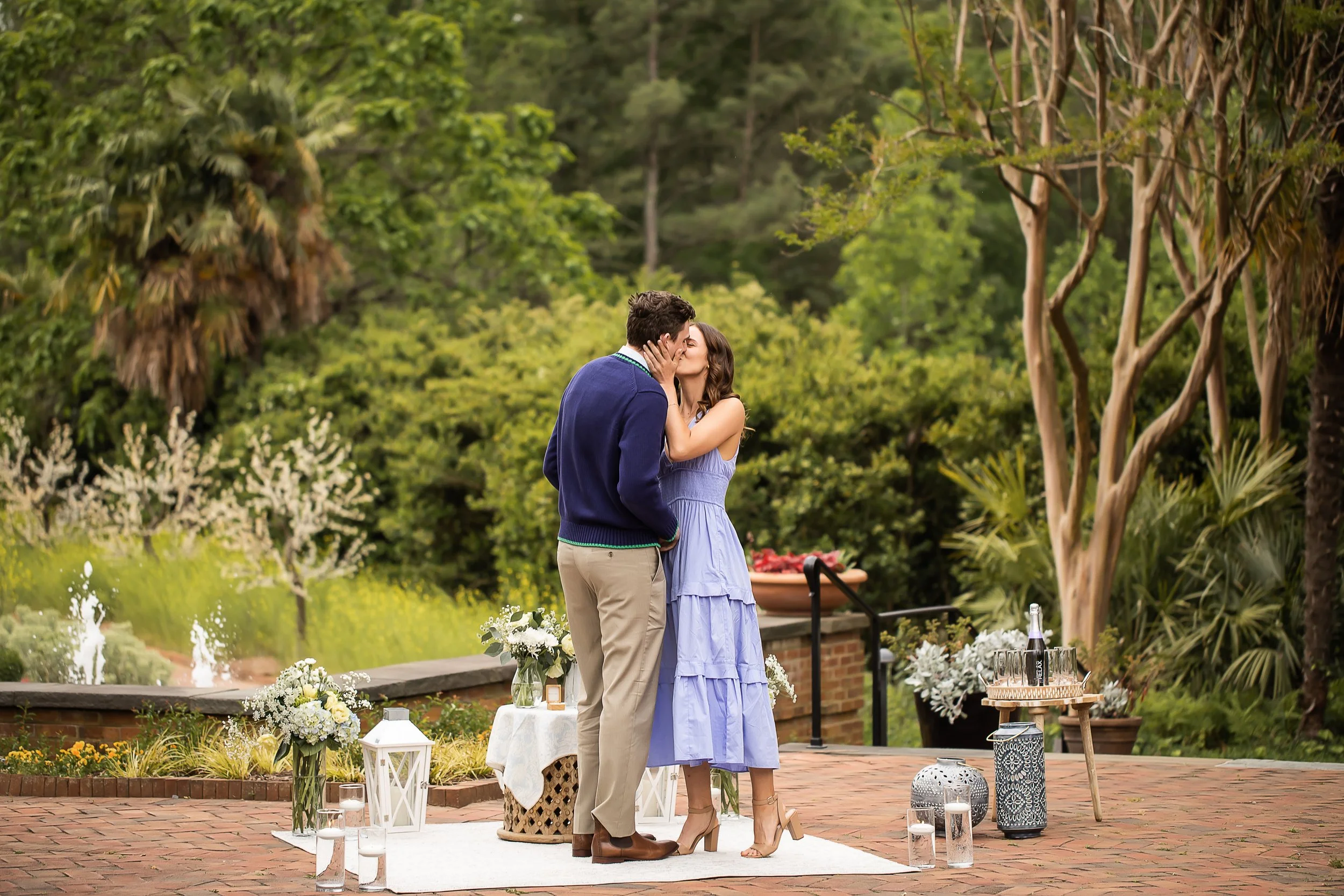 surprise engagement in the spring at botanical gardens in belmont nc