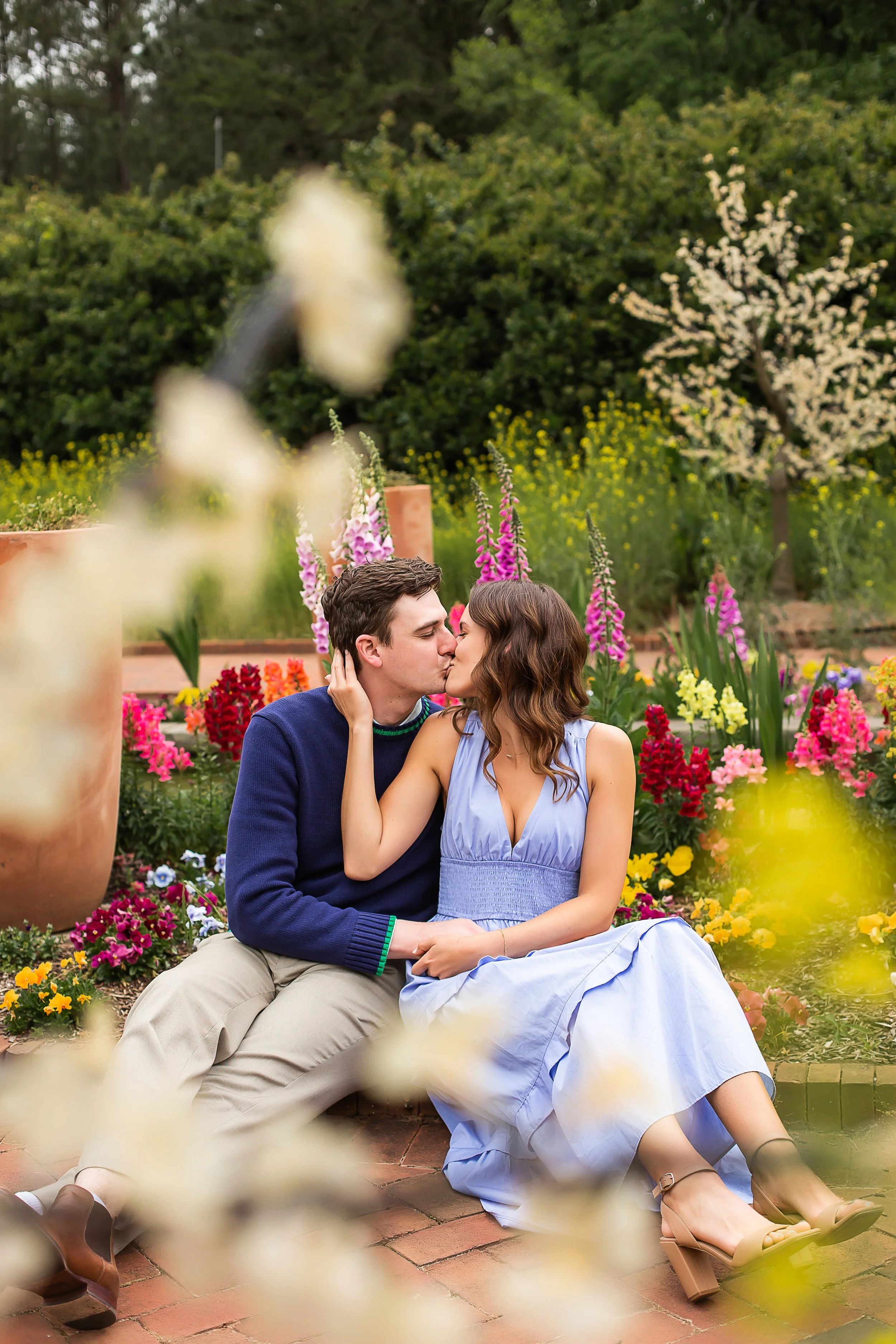newly engaged couple portraits engagement surprise proposal in the spring at daniel stowe botanical garden