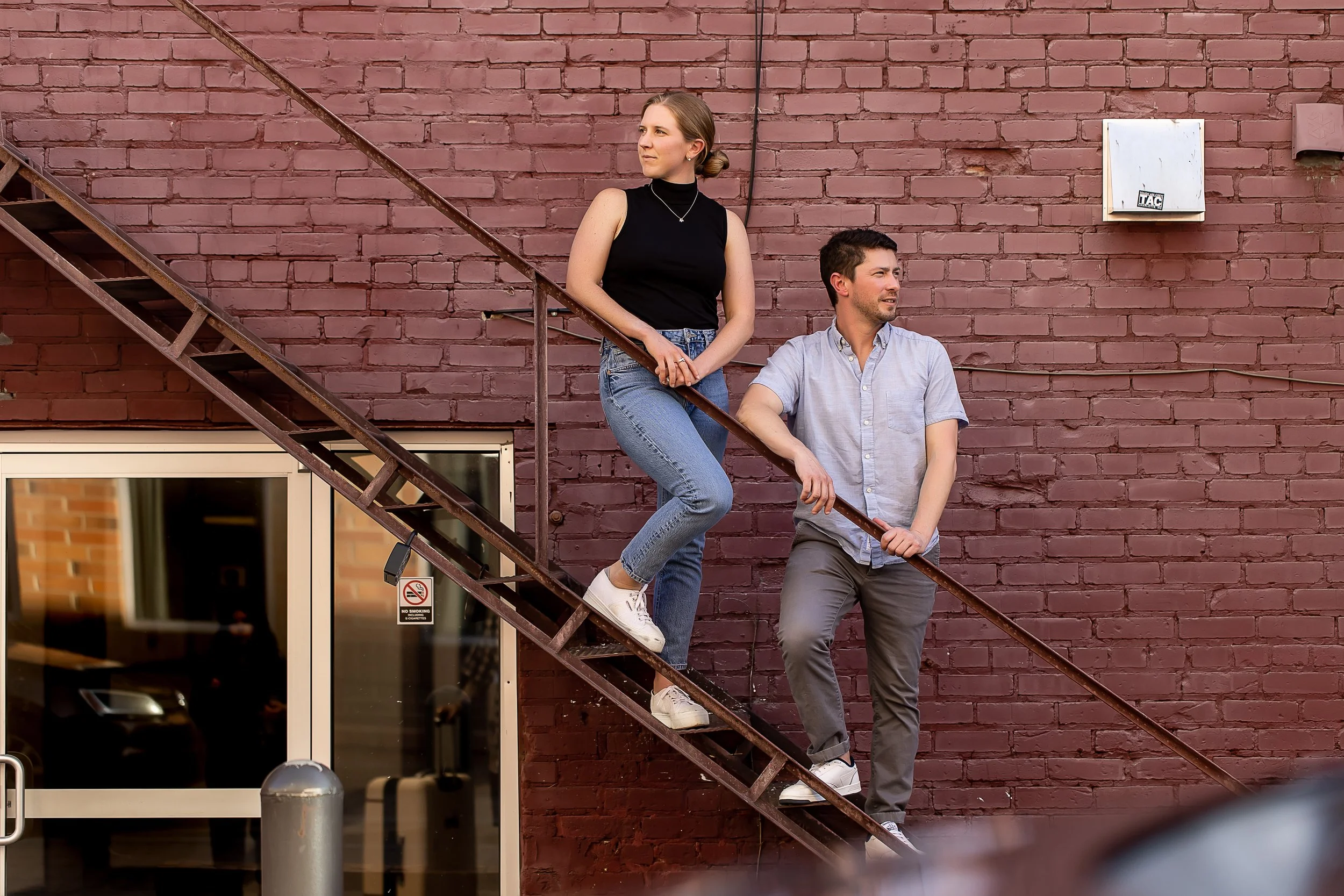 moody engagement photo charlotte nc red brick wall casual