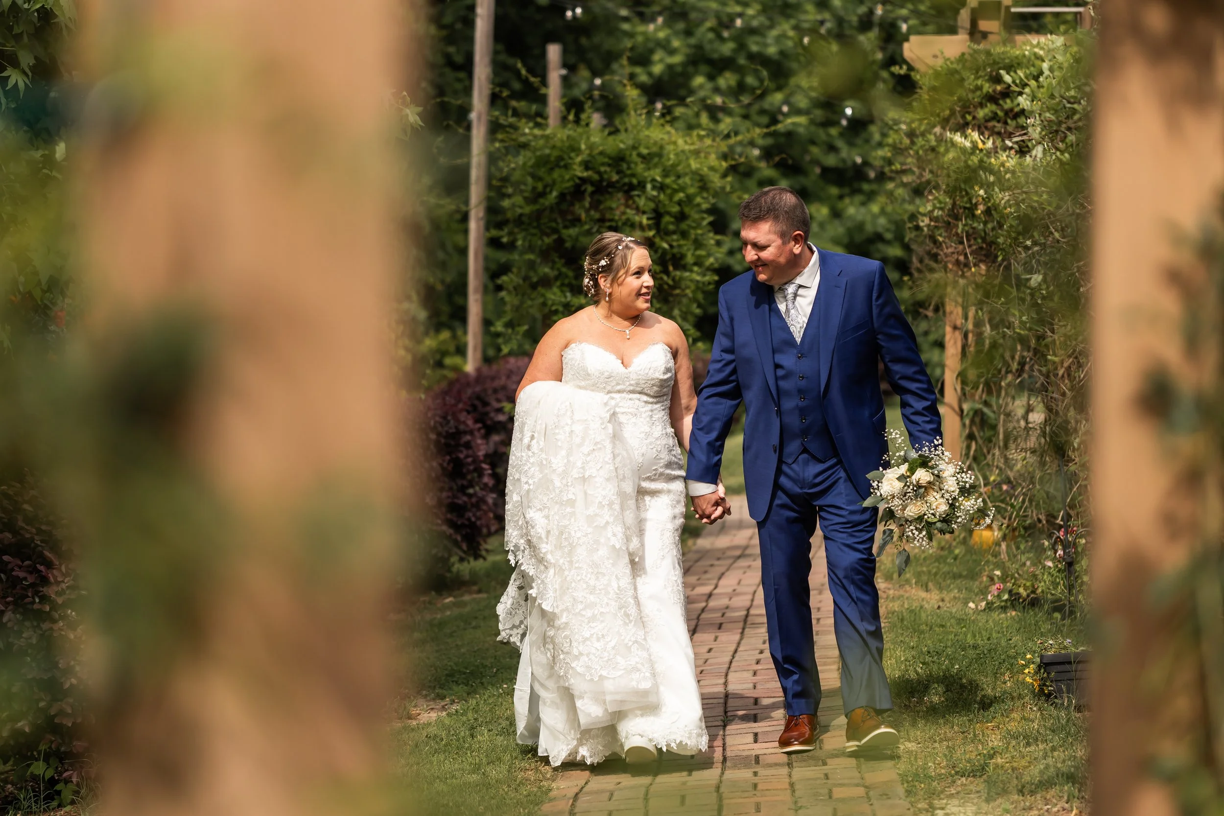 outdoor garden space bride and groom walking hand in hand micro wedding huntersville nc