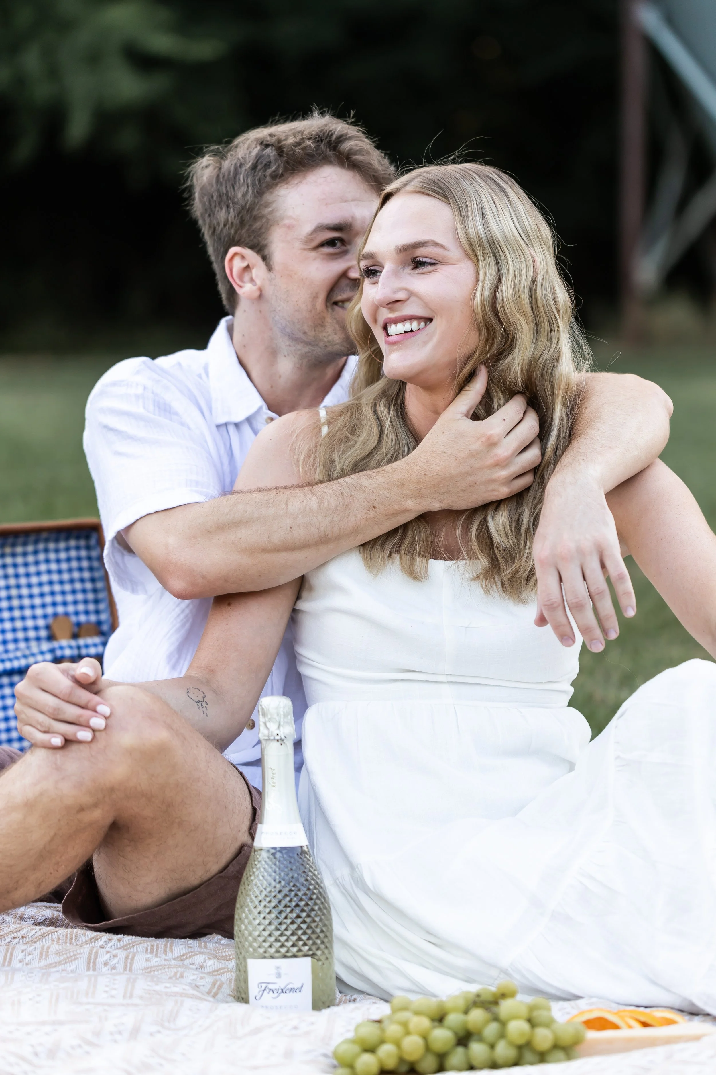 couple embracing white clothes 