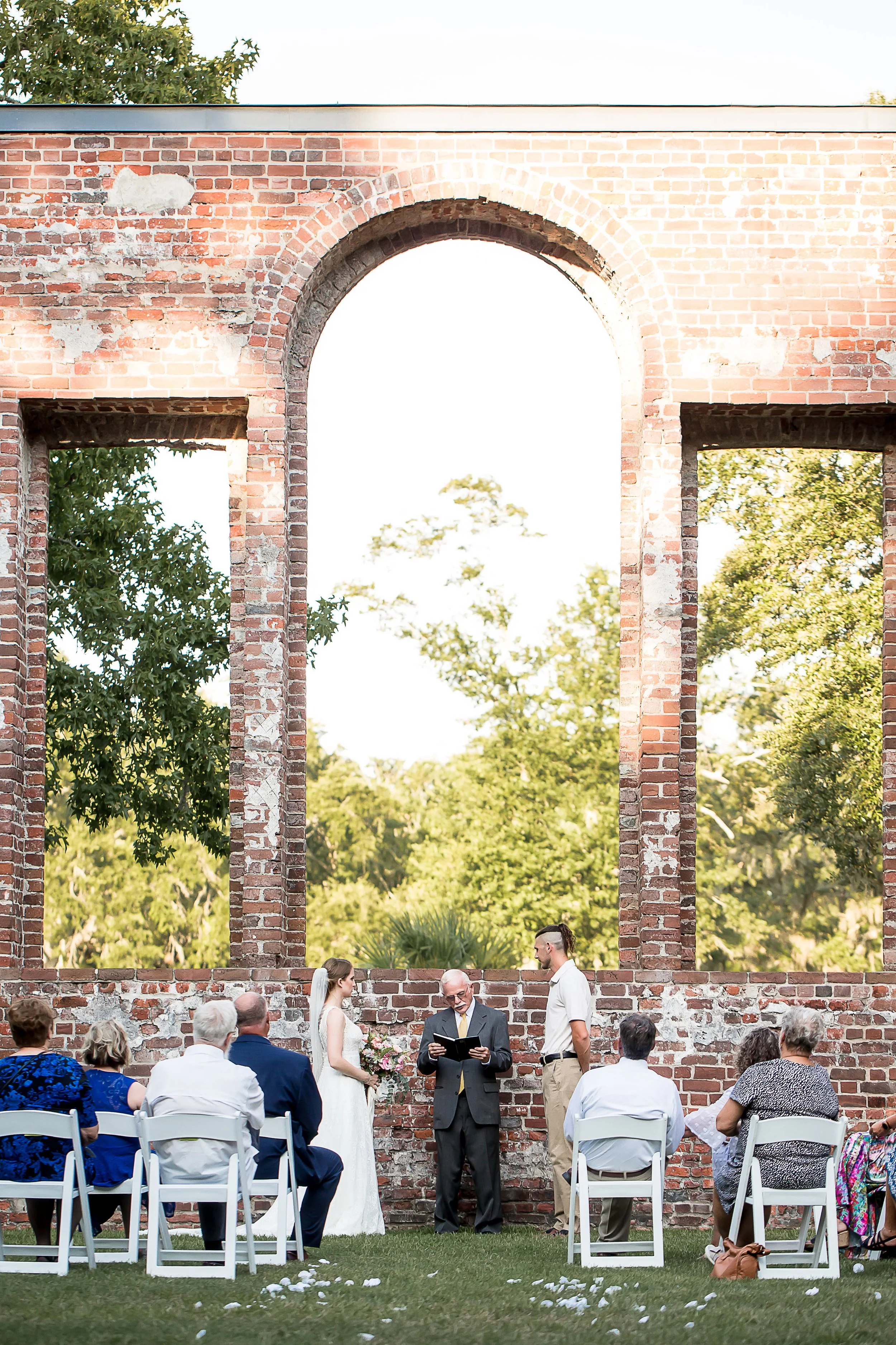 bride and groom wedding ceremony in church ruins wilmington nc