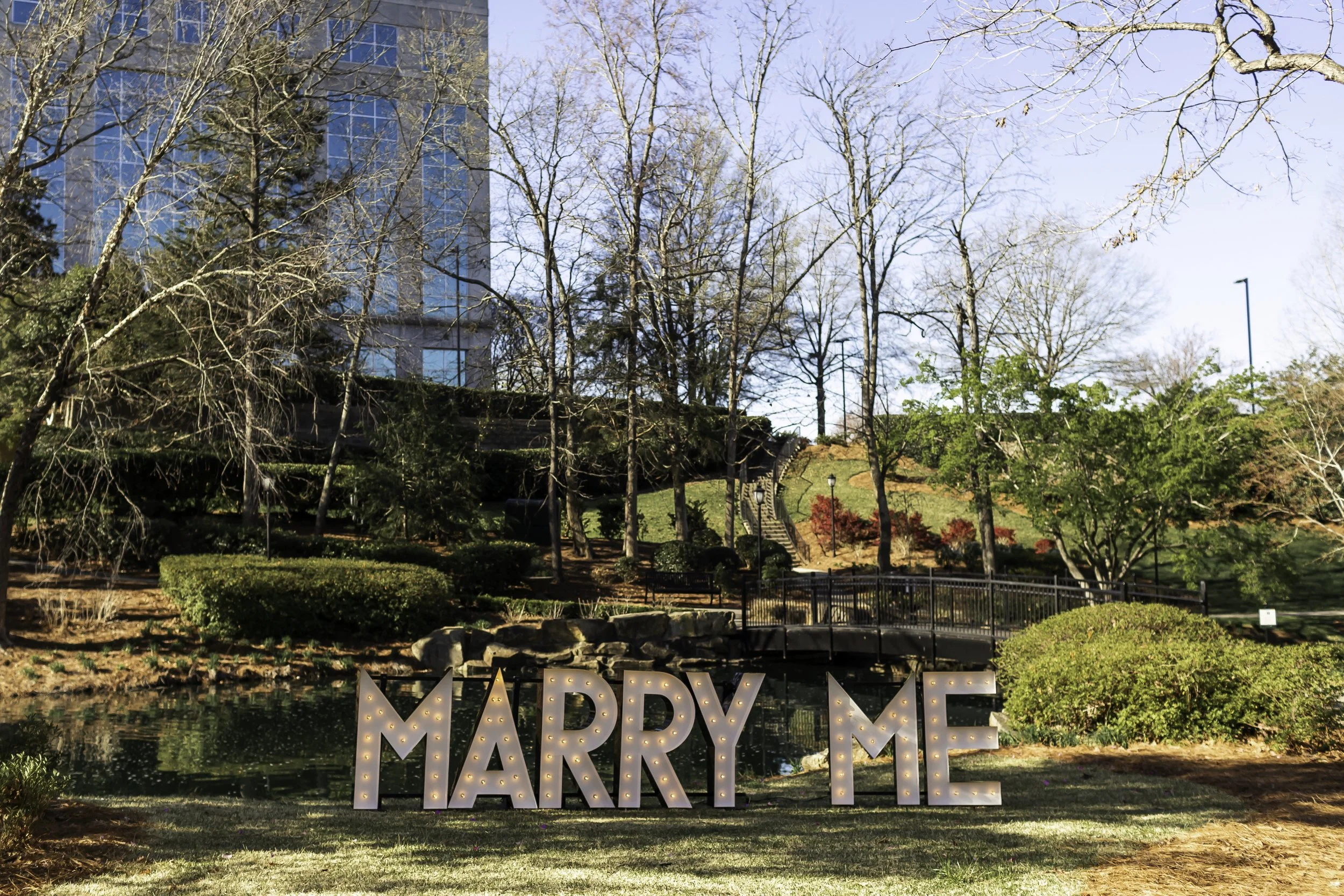 Marquee letters spelling 'Marry Me' set up at Cullman Park for a romantic surprise proposal.