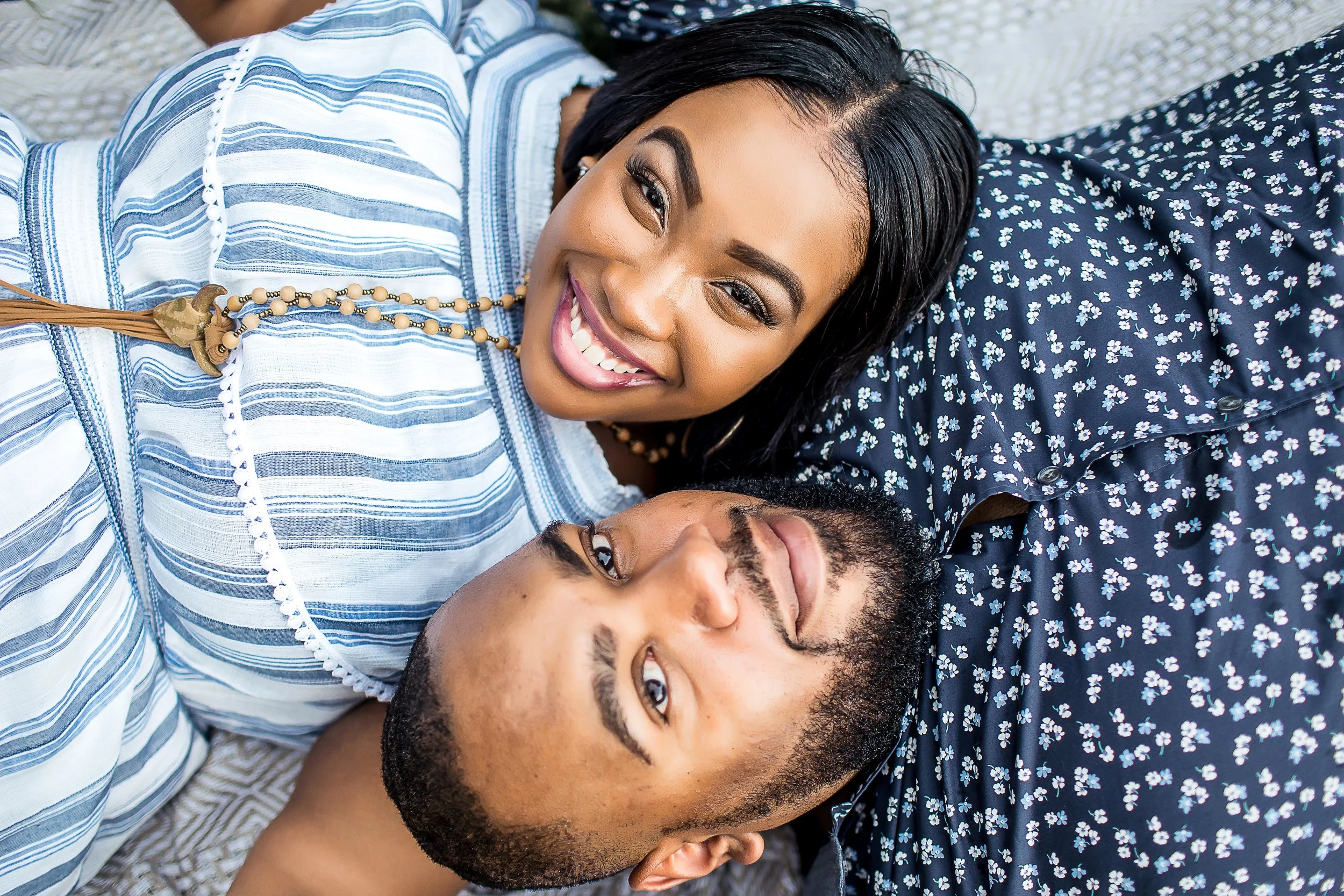 african american couple in blue engagement session park