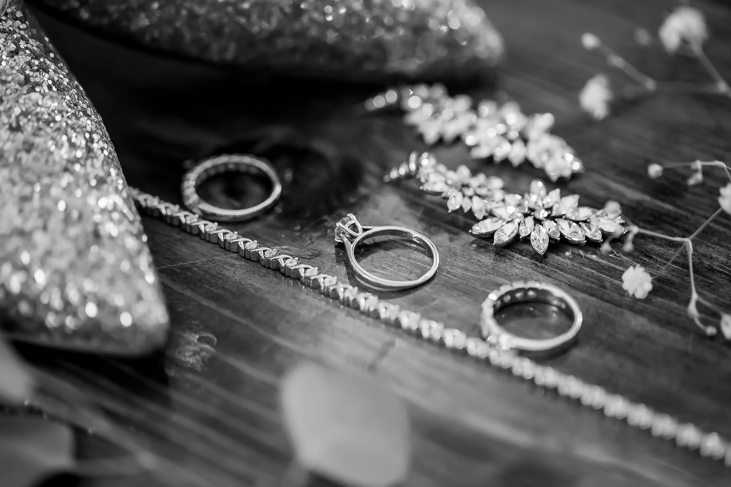black and white photo of bride wedding bands and engagement ring