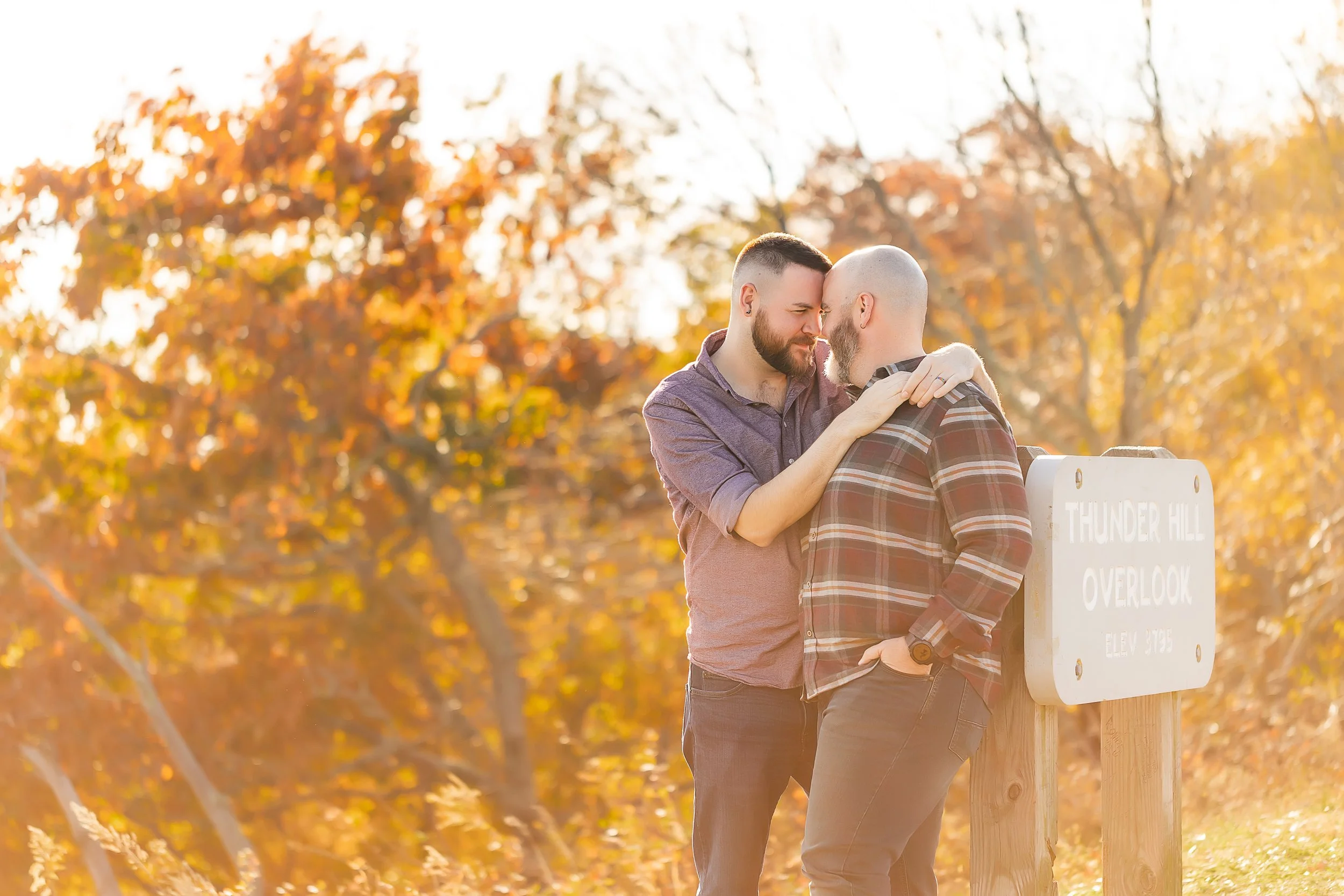 golden hour photo lgbt couple engagement overlook nc mountains thunder hill