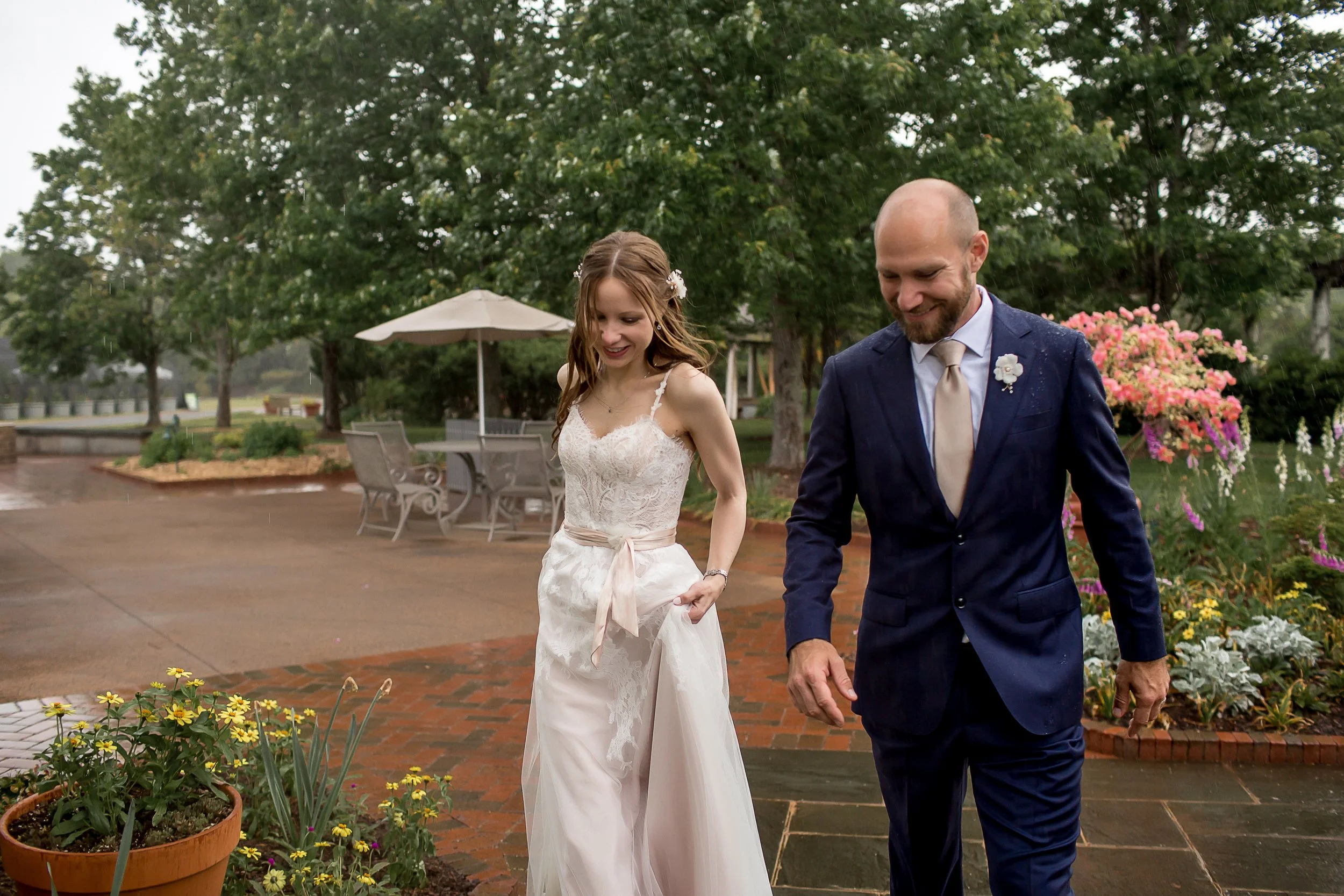 Newly married couple escaping the rain at daniel stowe botanical garden