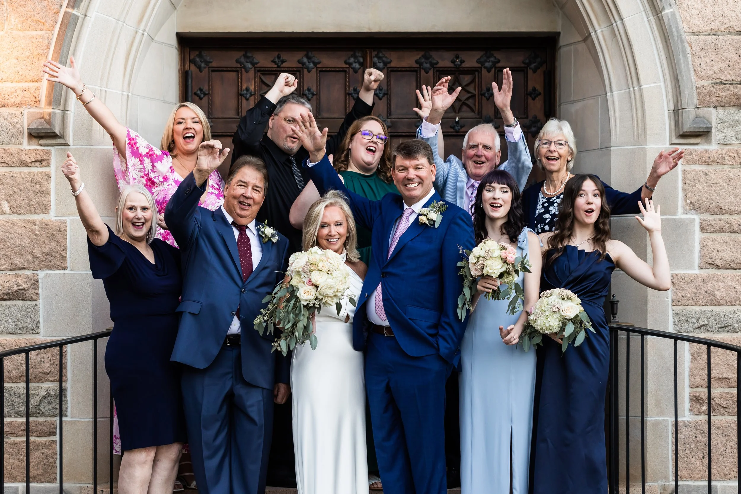 celebratory family photo after second wedding among mature couple