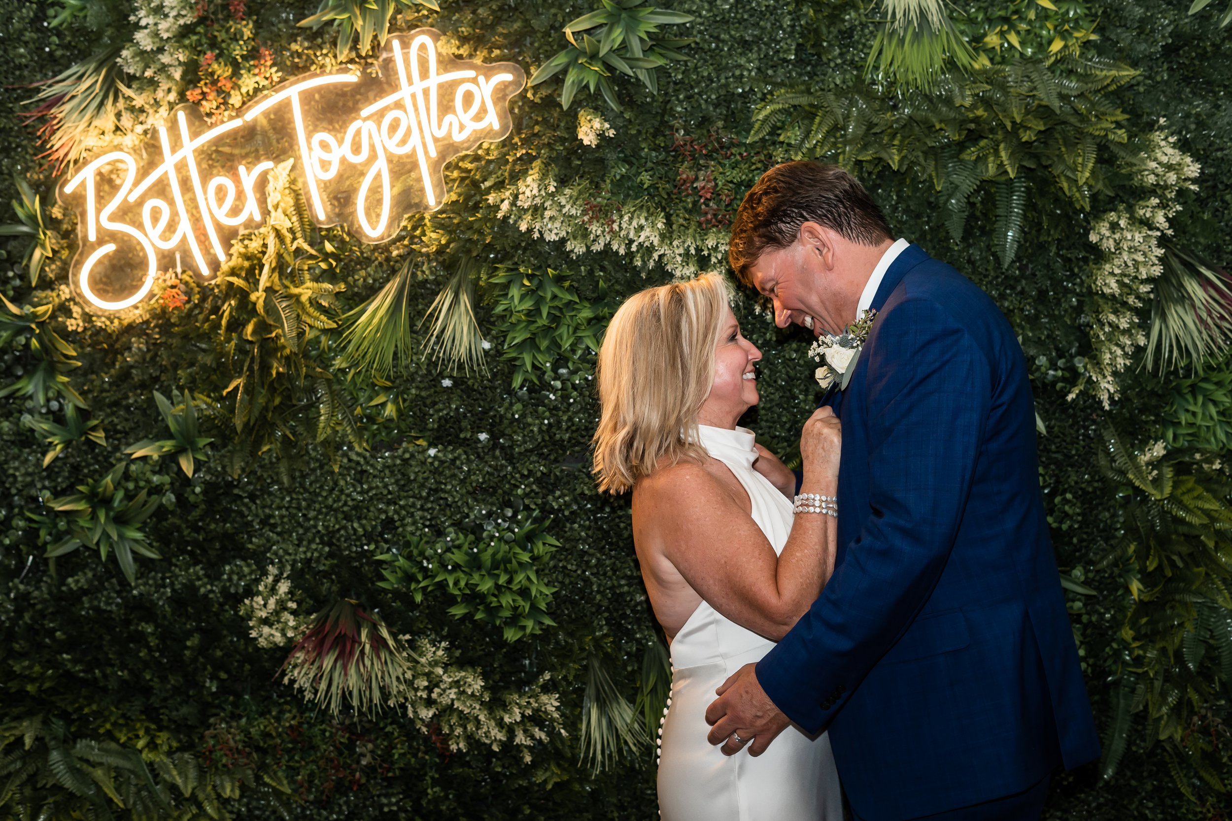 older couple wedding portrait neon sign better together charlotte nc the ruth venue