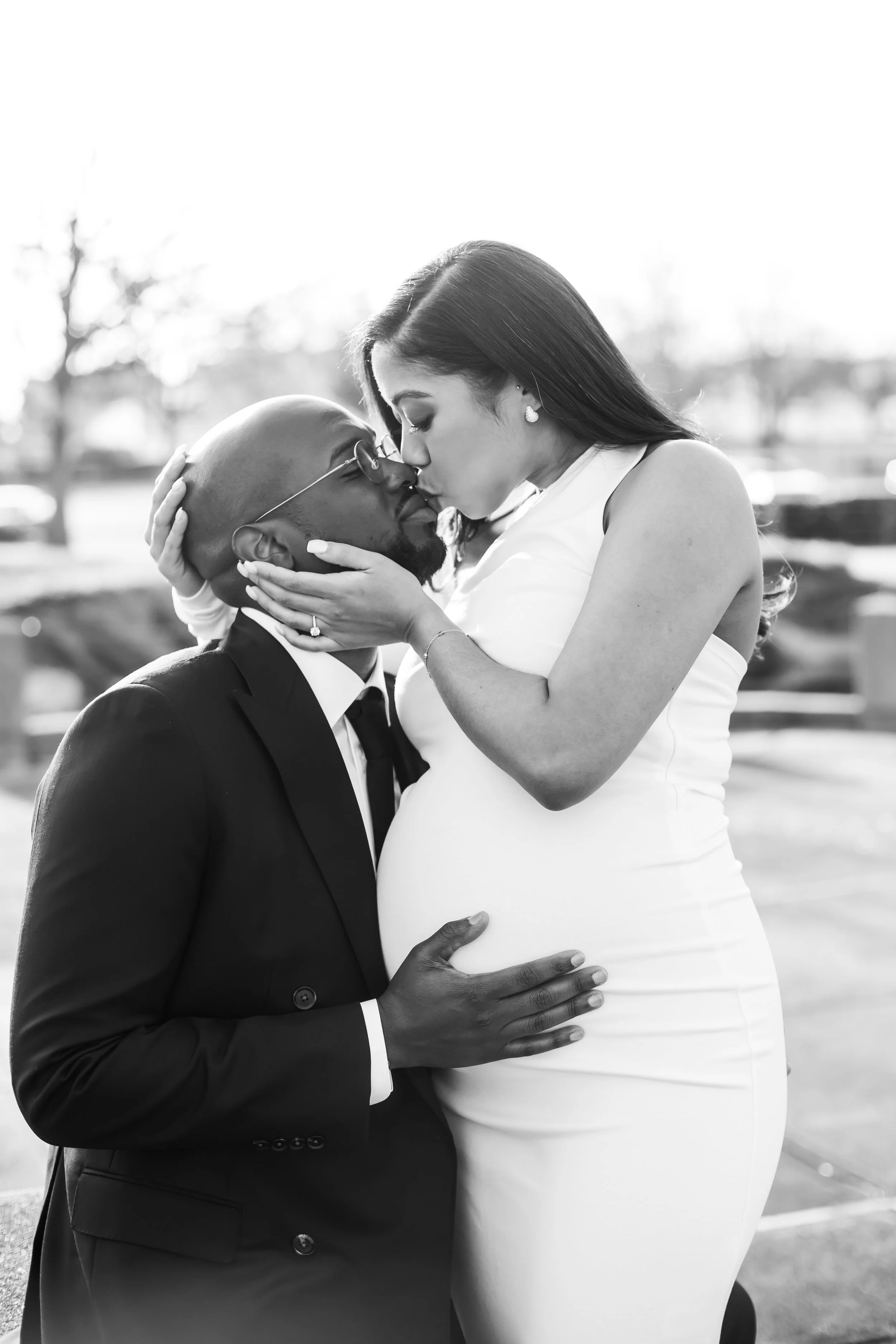black and white photo of african american expecting pregnant couple eloped downtown charlotte marshall park